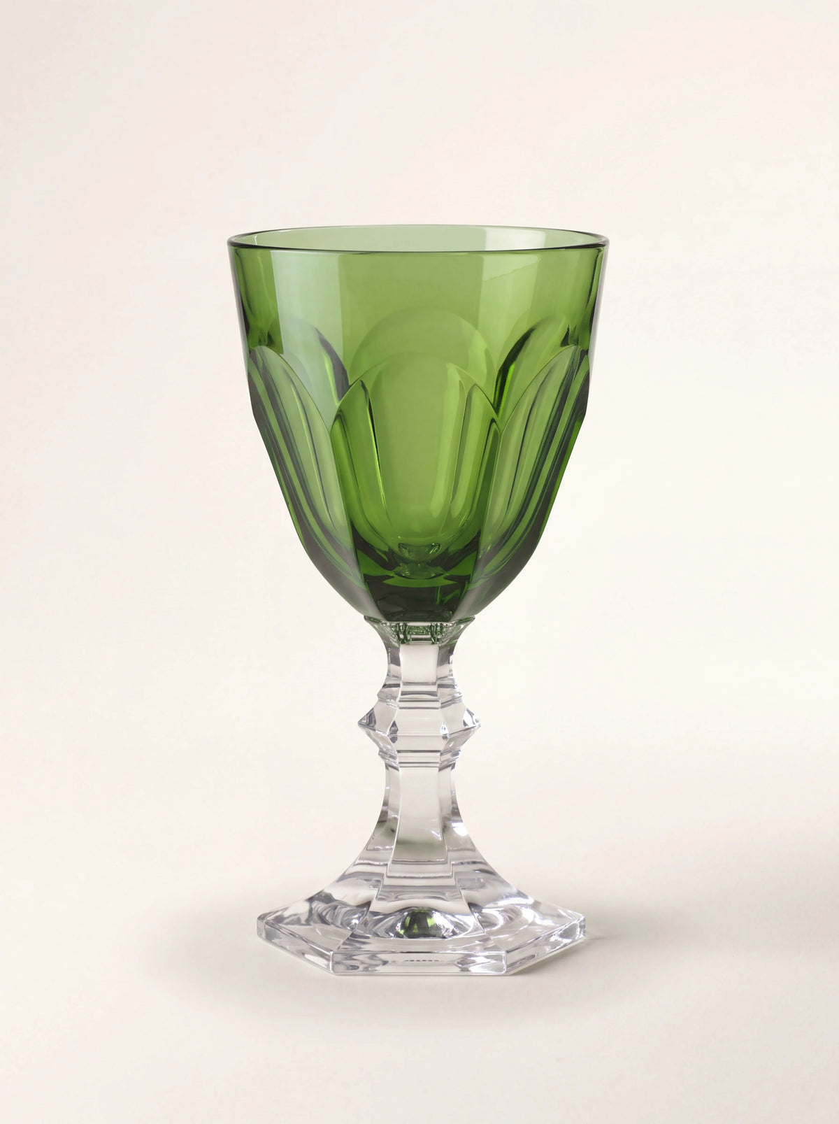 Green acrylic water glass with a panelled bowl, faceted clear stem and stepped hexagonal base