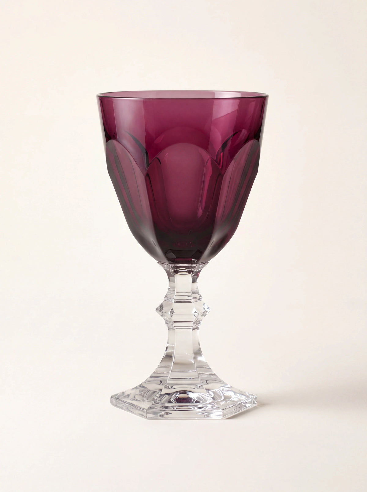 Acrylic wine glass with a panelled ruby bowl, clear faceted stem and octagonal base