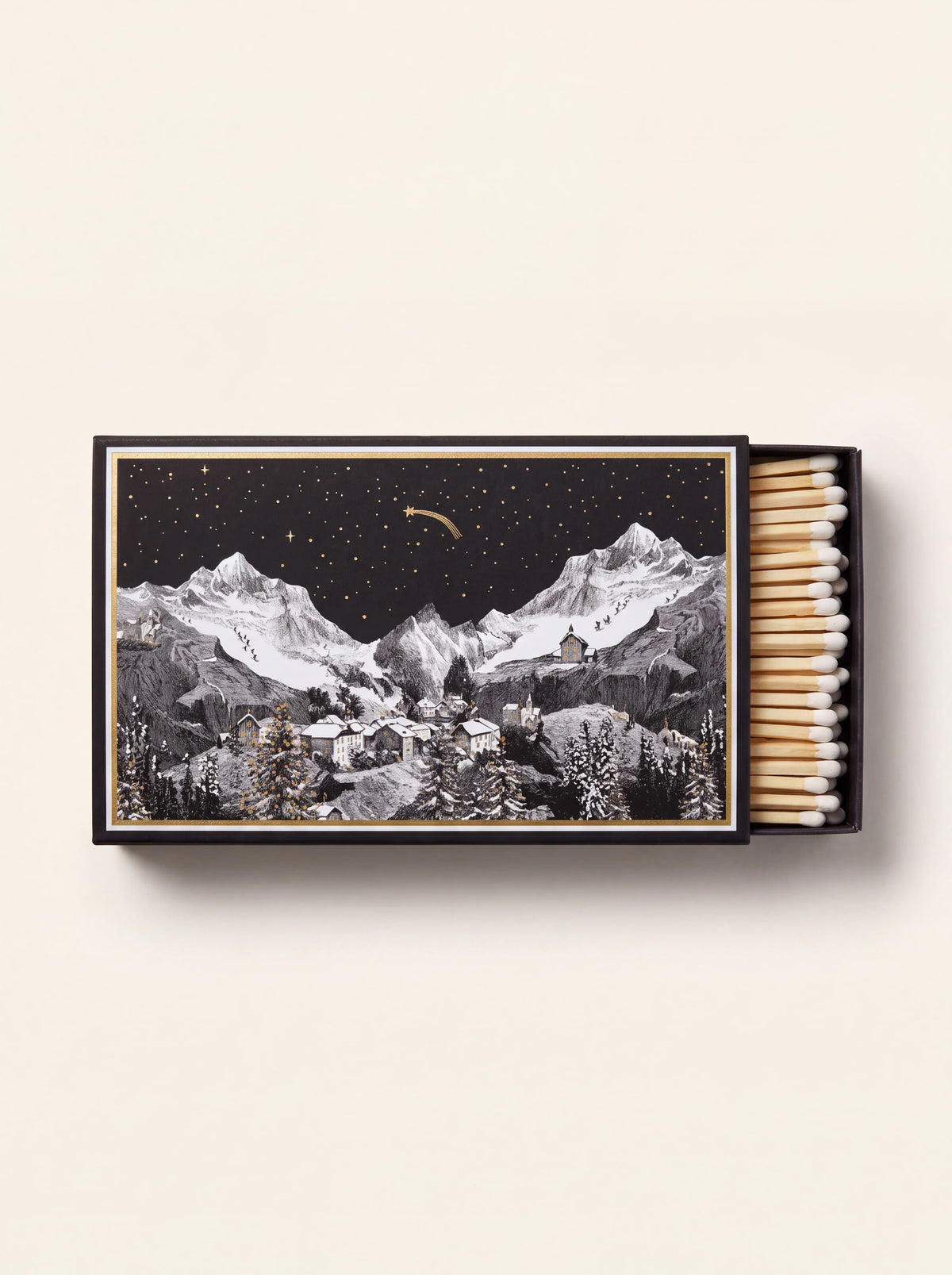 Giant matchbox with an alpine mountain night illustration, partly open showing white-tipped matches