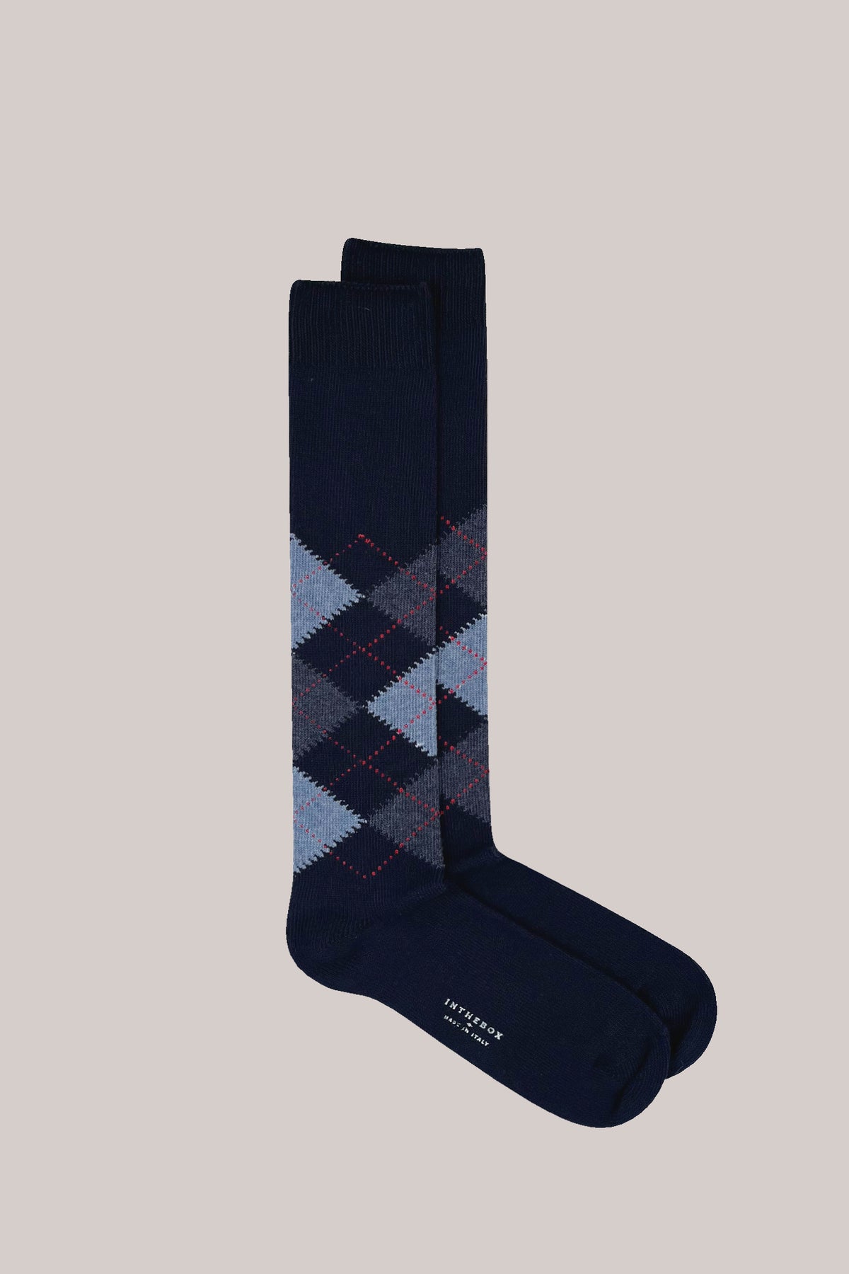 Navy blue argyle cotton socks with red dashed lines and 'INTHEBOX MADE IN ITALY' printed on the sole
