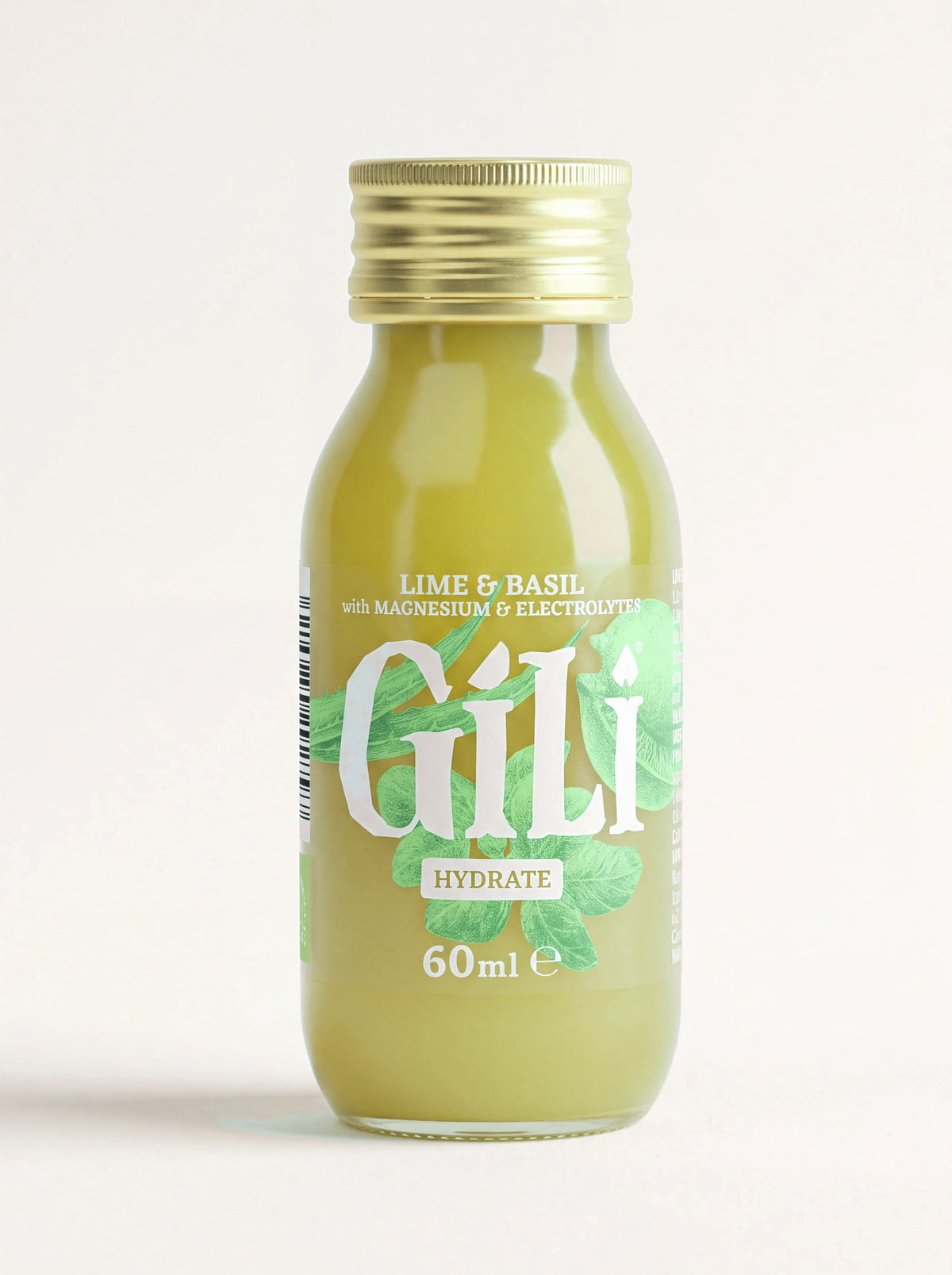 Lime and basil elixir shot in a 60 ml glass bottle with a gold screw cap, labelled Hydrate