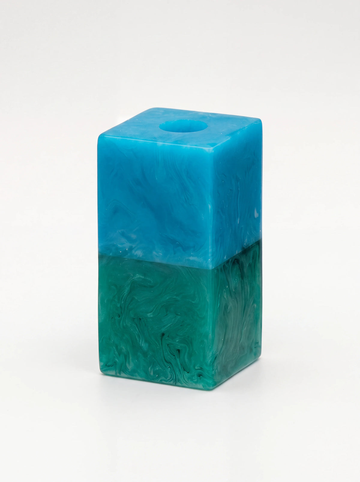 Rectangular resin candle holder with a marbled two-tone finish in bright blue and green
