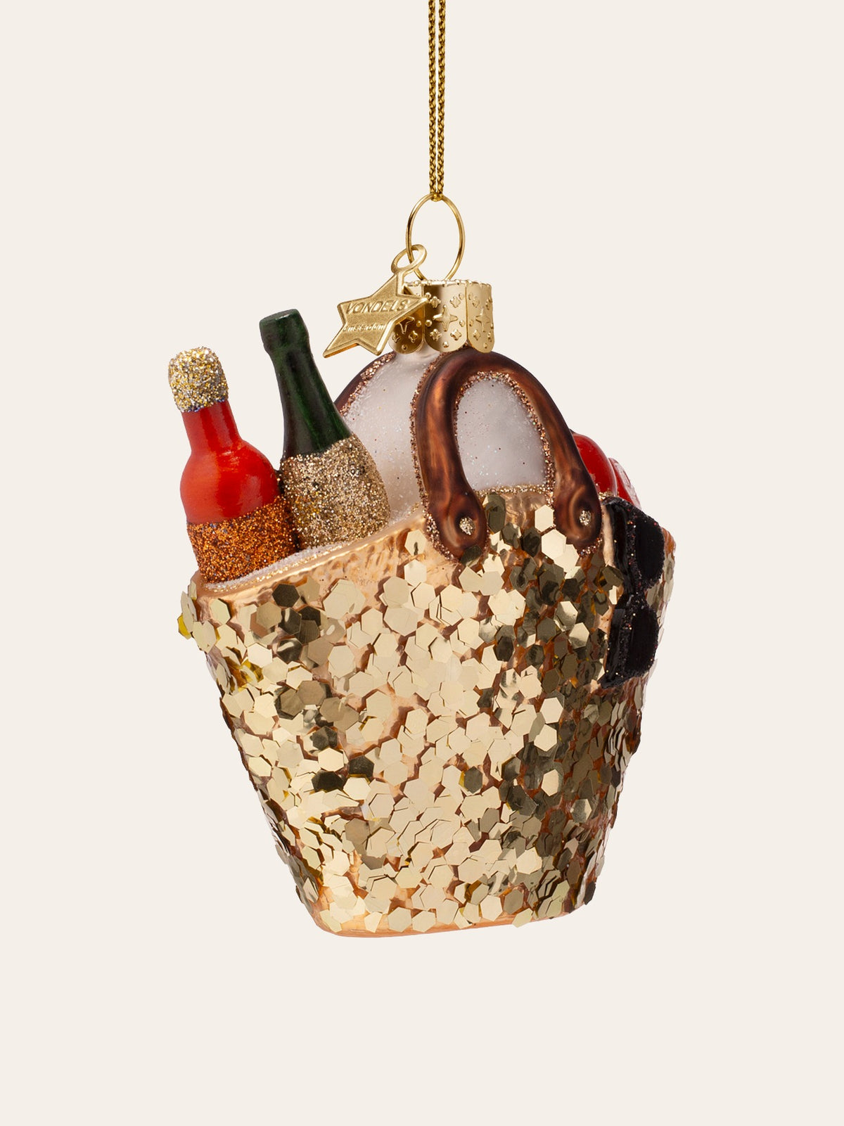 Three-quarter view of the beach bag ornament showing the sequin texture and brown loop handles