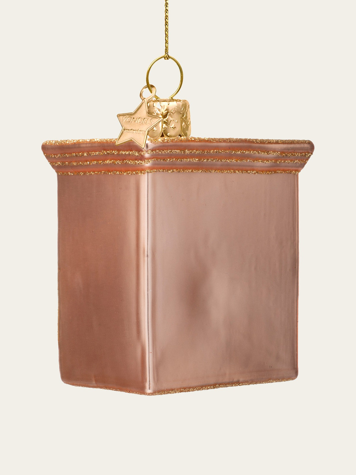 Reverse view of the pink glass ornament with glitter trim along the upper moulding