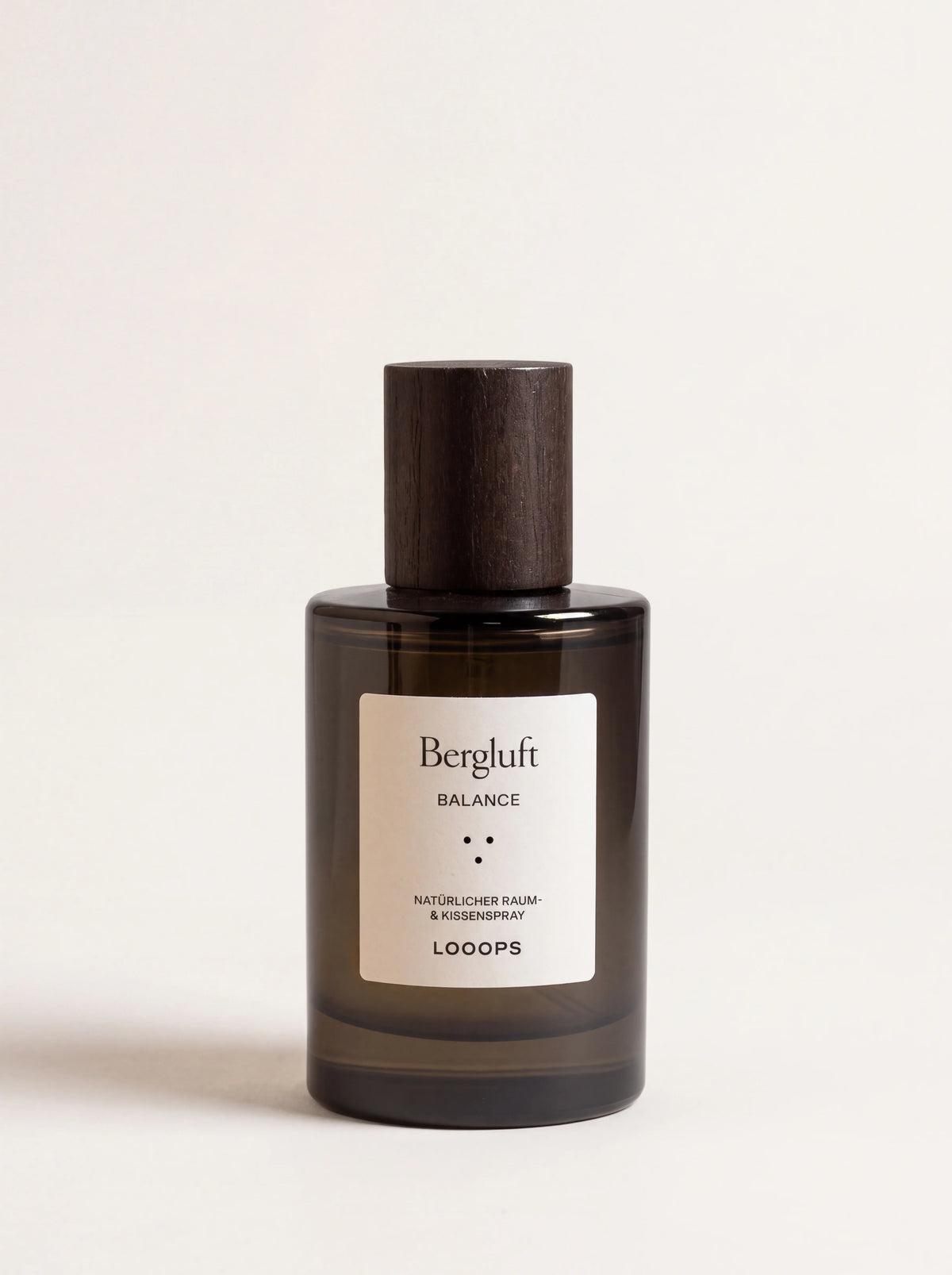 Bergluft room spray in a dark glass bottle with a dark wooden cap and label reading Bergluft Balance