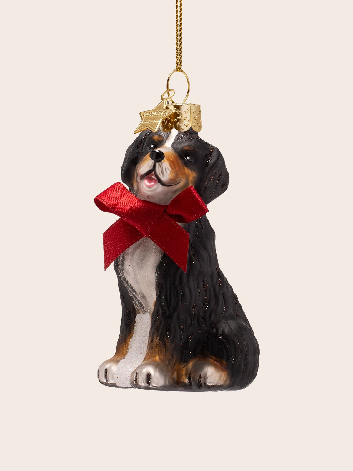 Glass dog ornament in three-quarter view, showing the glitter finish and open mouth