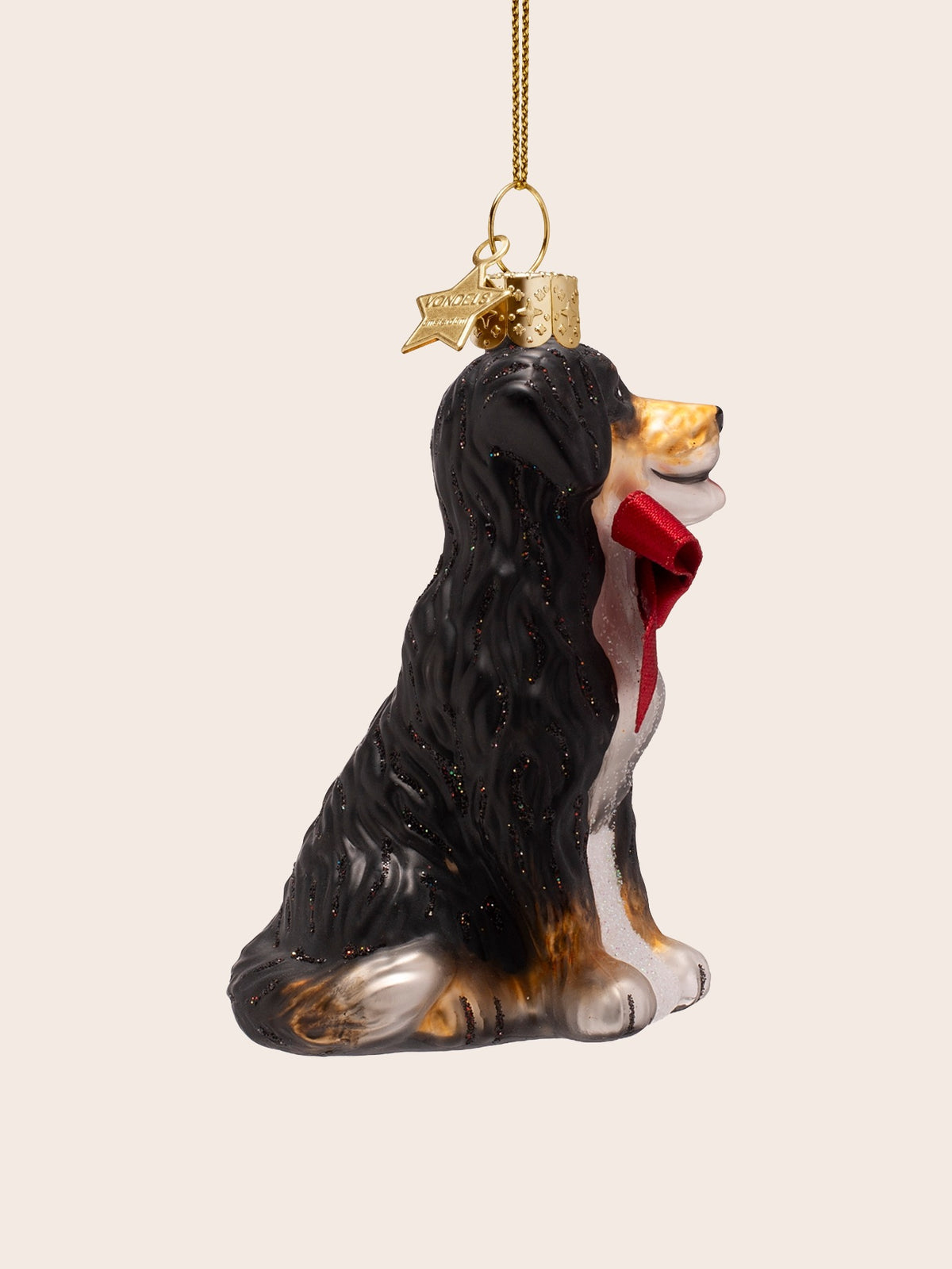 Side profile of the glass dog ornament showing the wavy coat texture along the back
