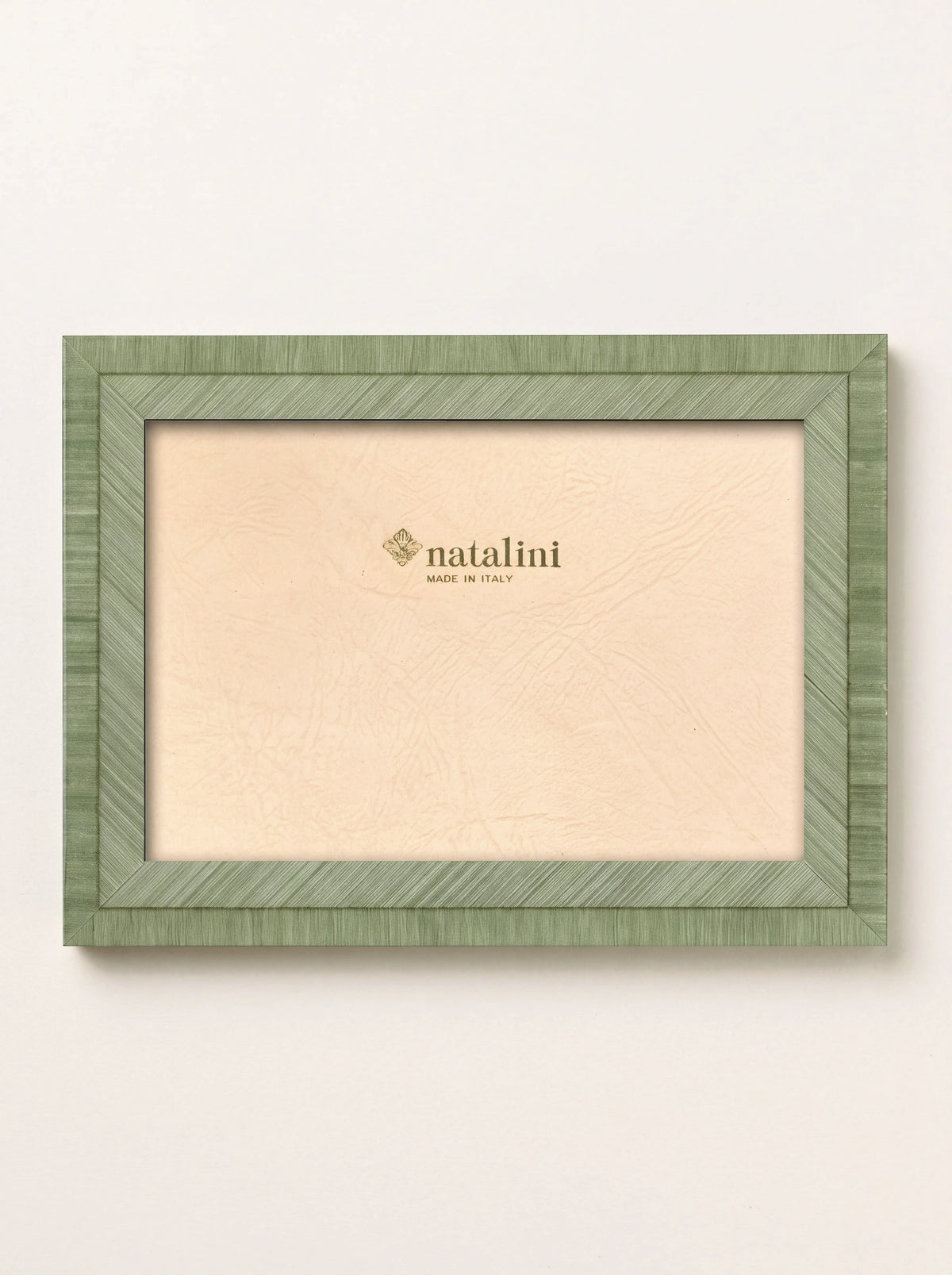 Light green wood veneer photo frame with fine line inlay and paper insert reading 'natalini MADE IN ITALY