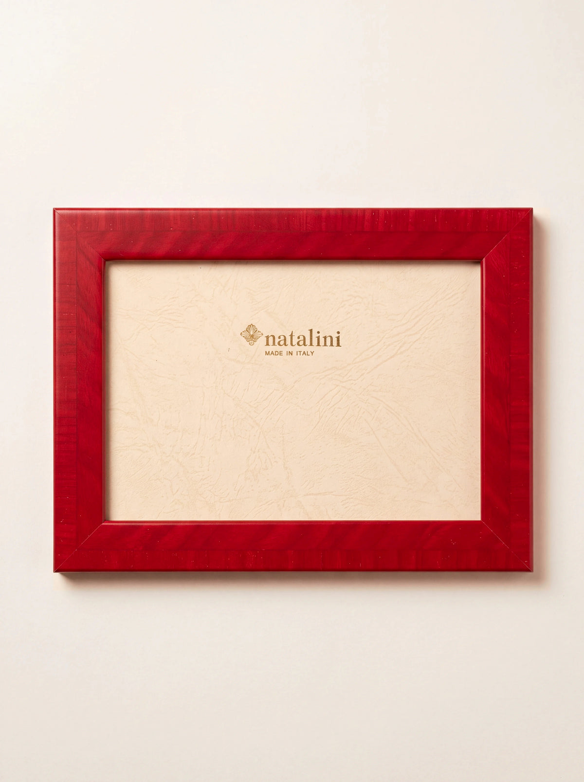 Rectangular photo frame in glossy red inlaid wood veneer with insert reading natalini MADE IN ITALY