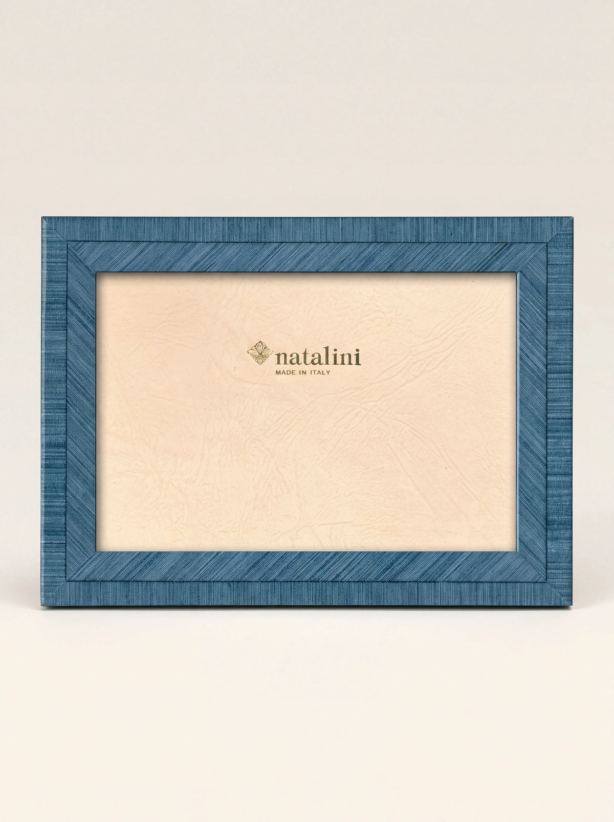 Sky blue inlaid wood veneer photo frame with paper insert reading natalini MADE IN ITALY