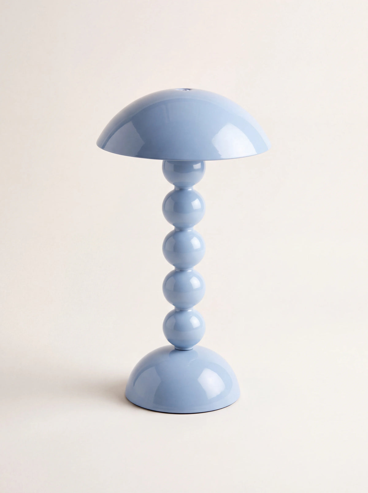 Pale denim blue bobbin LED lamp with a glossy domed shade and stacked-ball stem