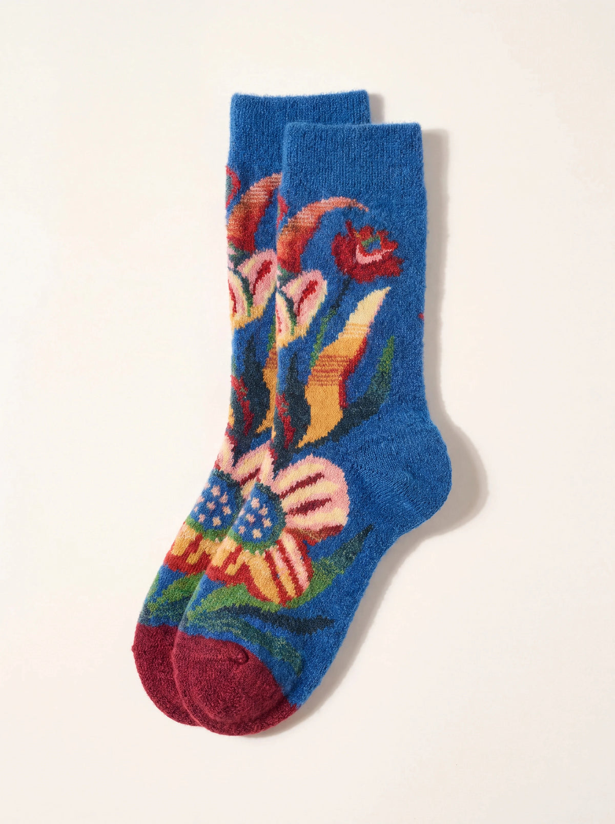 Wool-blend socks in blue with a colourful floral motif, ribbed cuffs and dark red toes