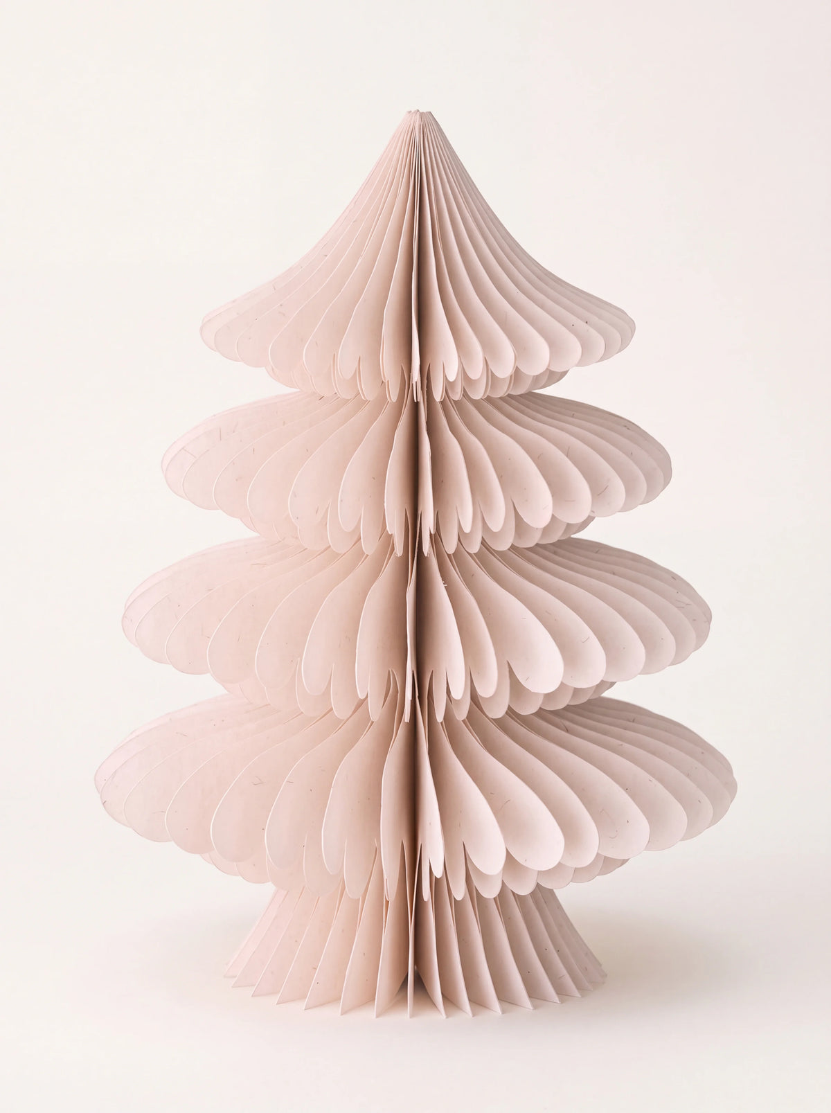 Tiered paper Christmas tree in powder pink with pleated honeycomb folds