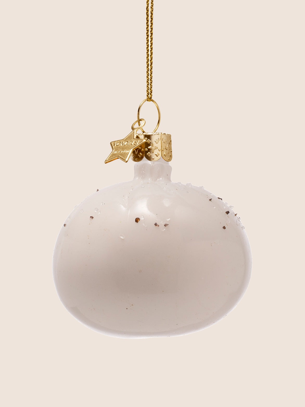 Back view showing the smooth, rounded white glass burrata with delicate specks on top