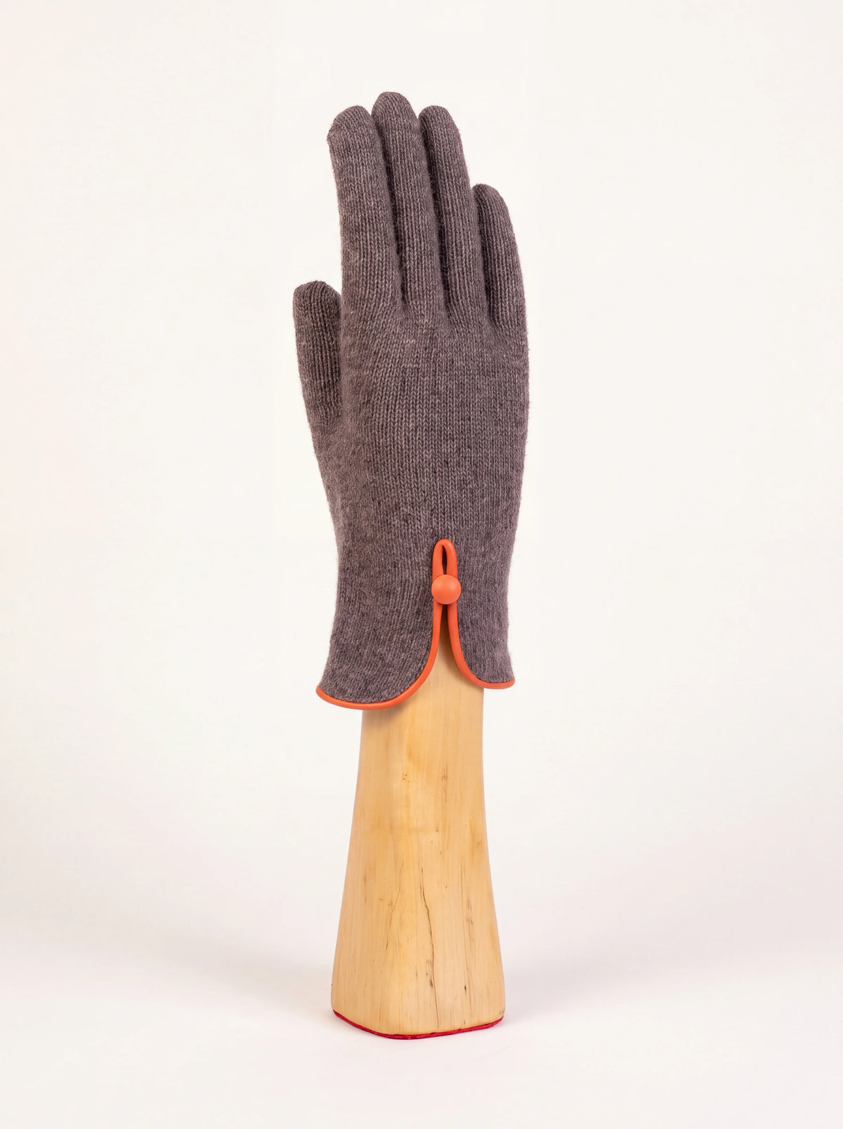 Taupe wool and cashmere glove with an orange piped slit cuff and button-and-loop closure