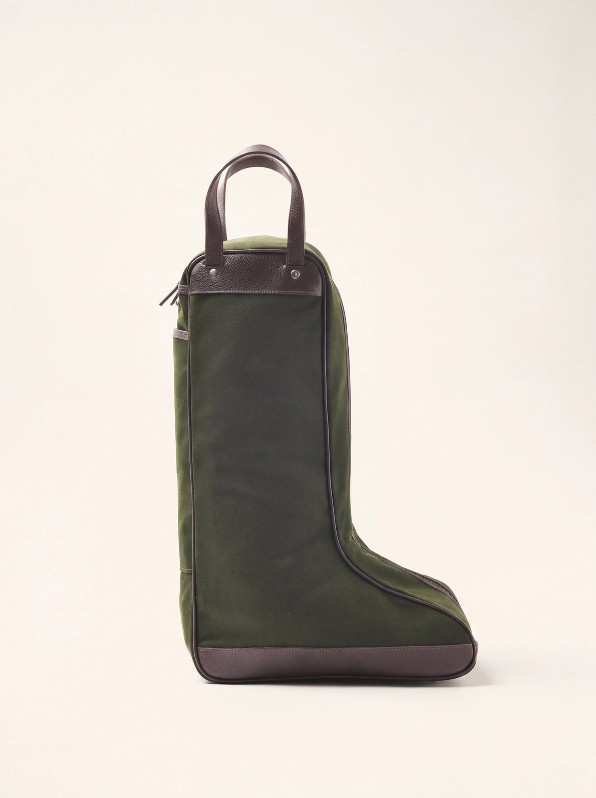 Waxed canvas boot carrier in dark green with brown leather trim, twin top handles and reinforced base