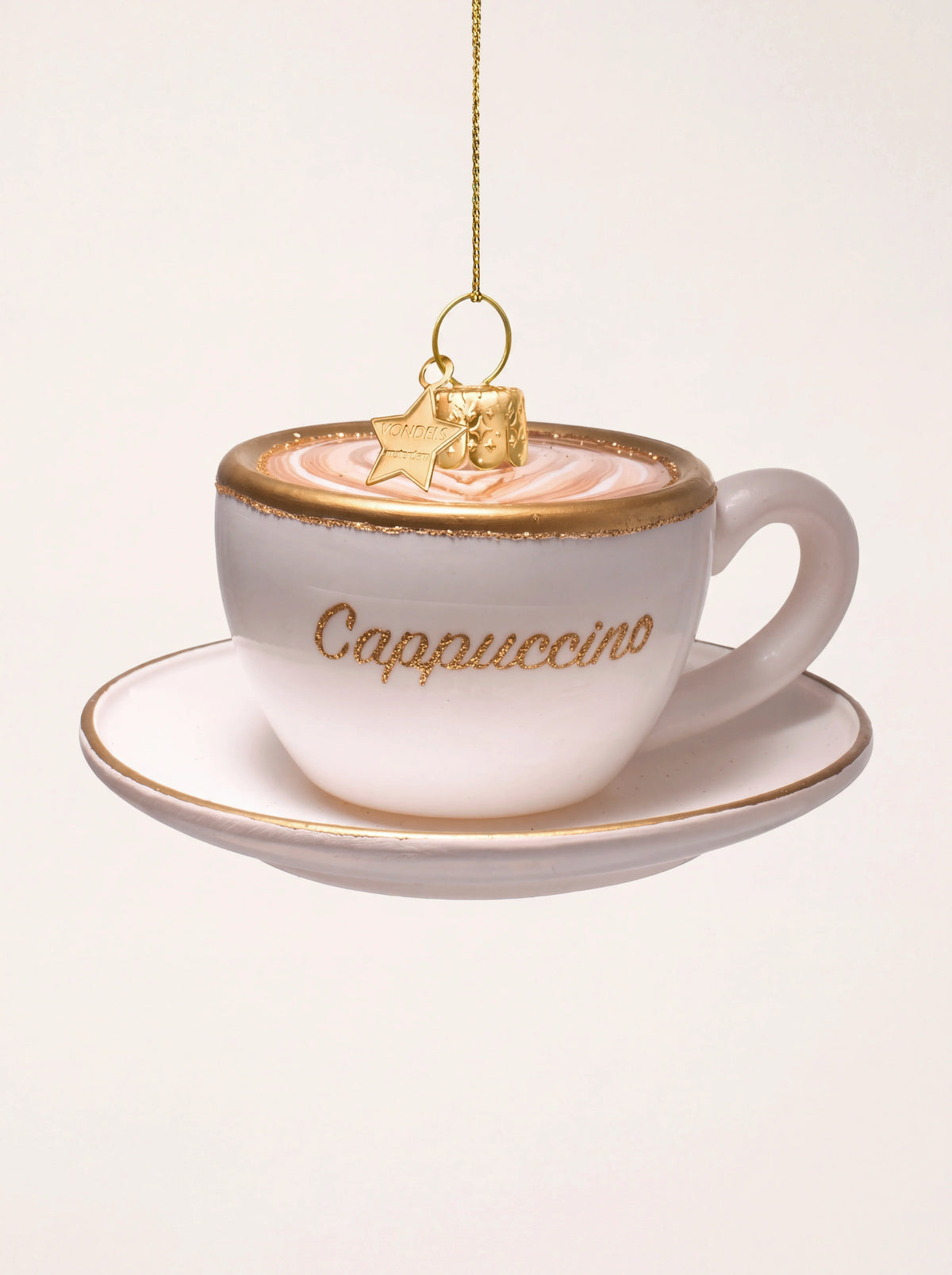 Glass cappuccino cup Christmas ornament on a saucer, with latte art and gold glitter Cappuccino lettering