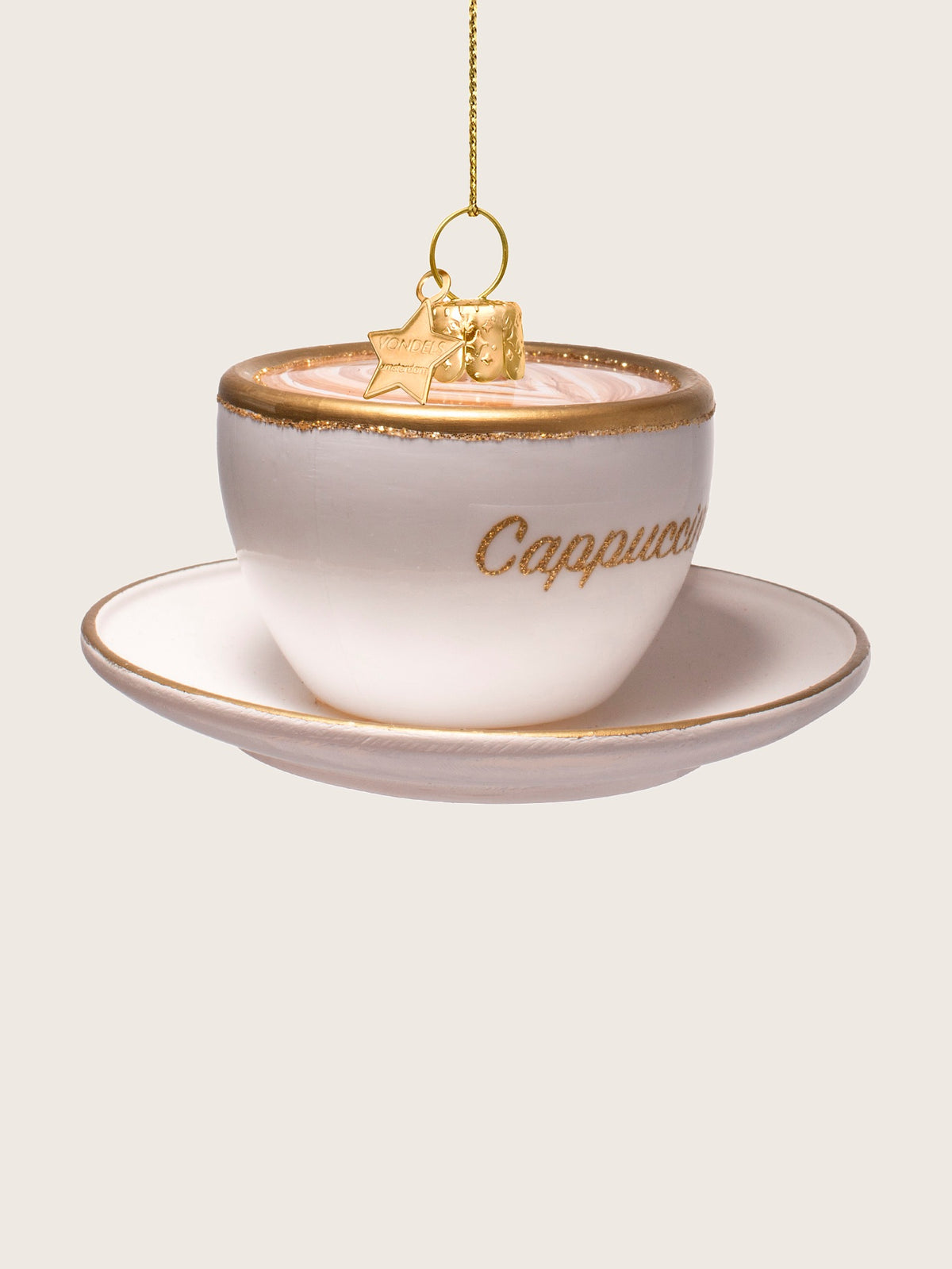 Turned view of the glass cappuccino cup ornament, showing the rounded bowl and gold-painted rim