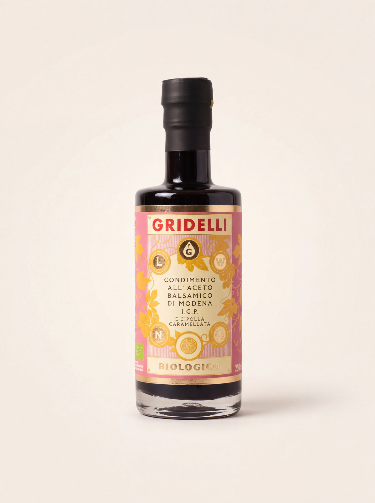 Caramelised onion balsamic vinegar in a glass bottle with a pink and gold label