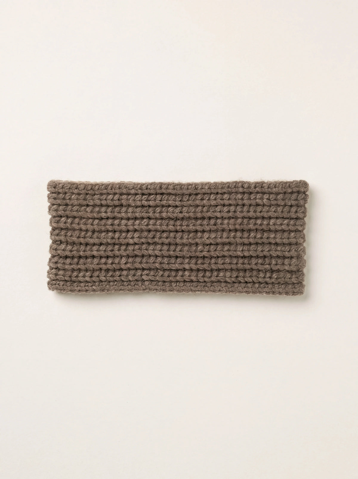 Brown knitted cashmere headband with a horizontal ribbed pattern, shown flat