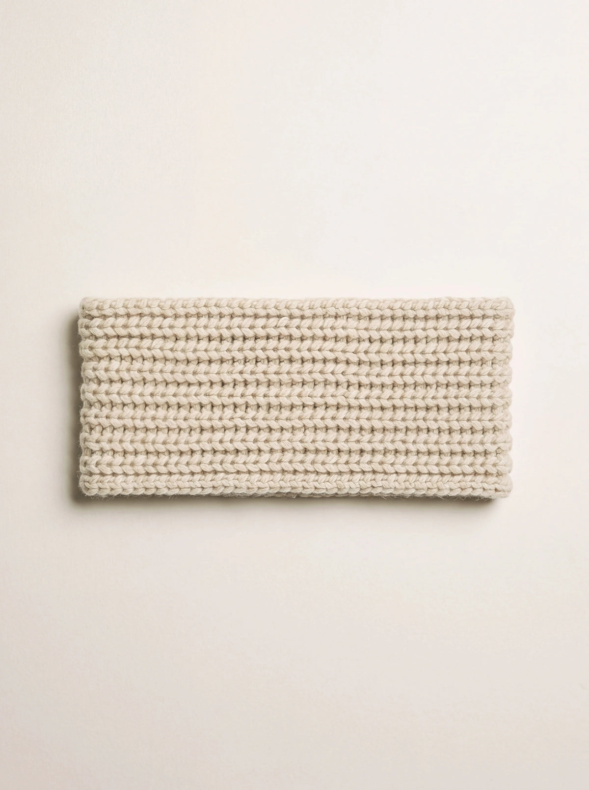 Sand cashmere headband with horizontal rib knit, laid flat