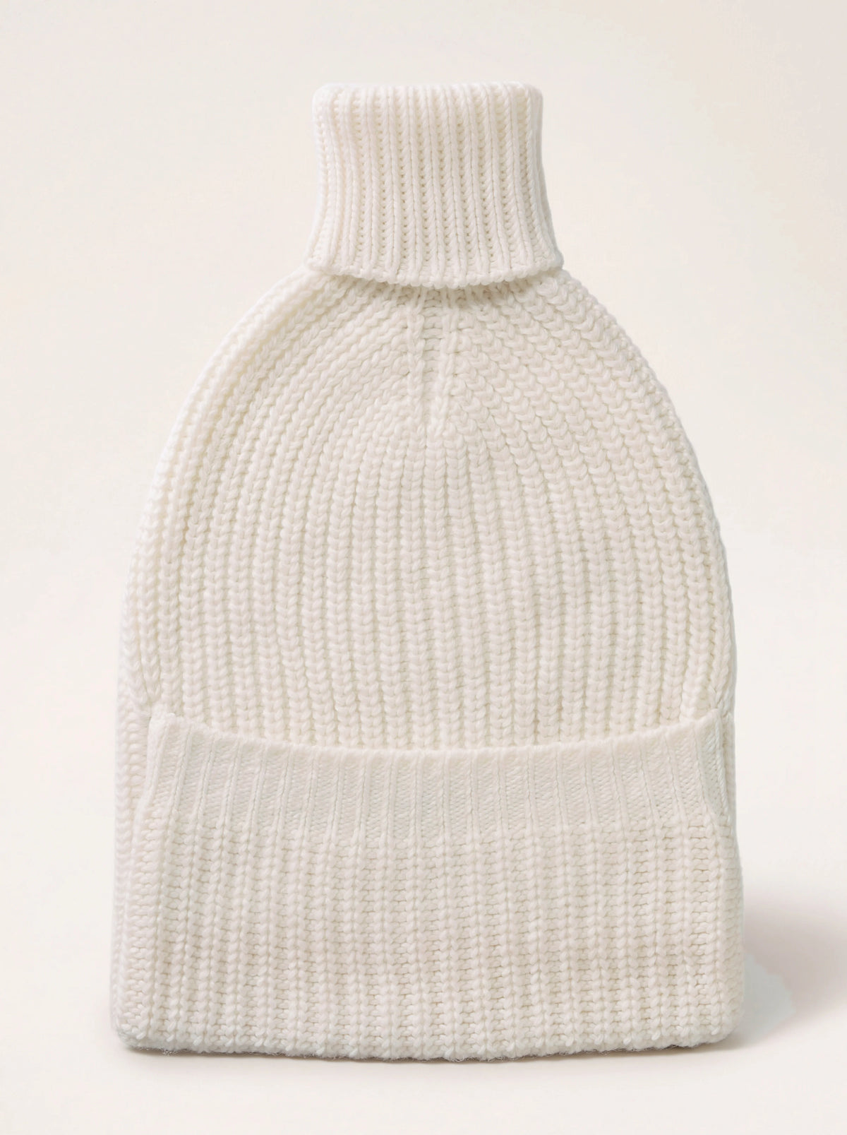 Ivory ribbed cashmere hot water bottle cover with a knitted roll neck and front pocket