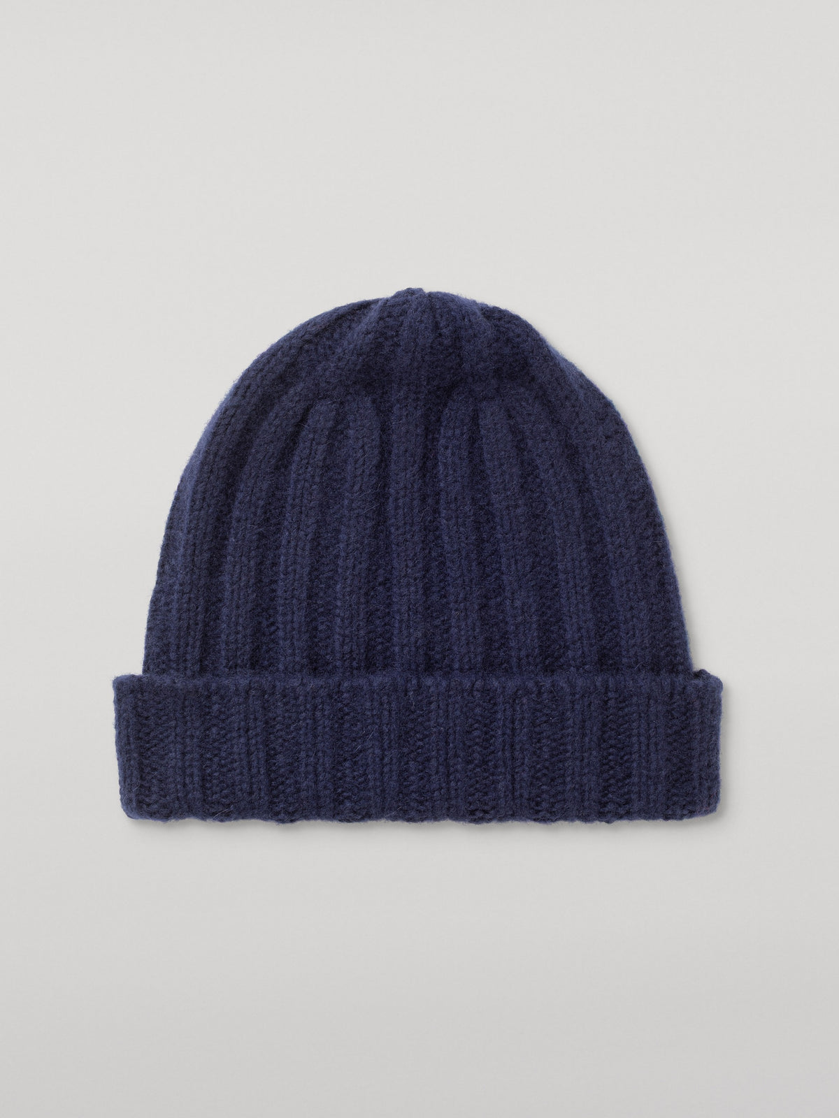 Navy blue ribbed cashmere-silk beanie shown with a turned-up cuff