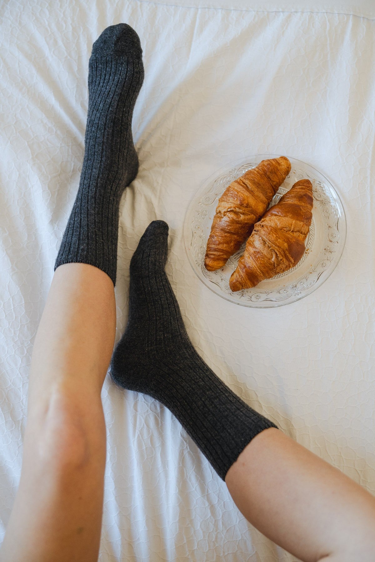 Ribbed graphite socks in a merino wool and cashmere blend, worn to mid-calf