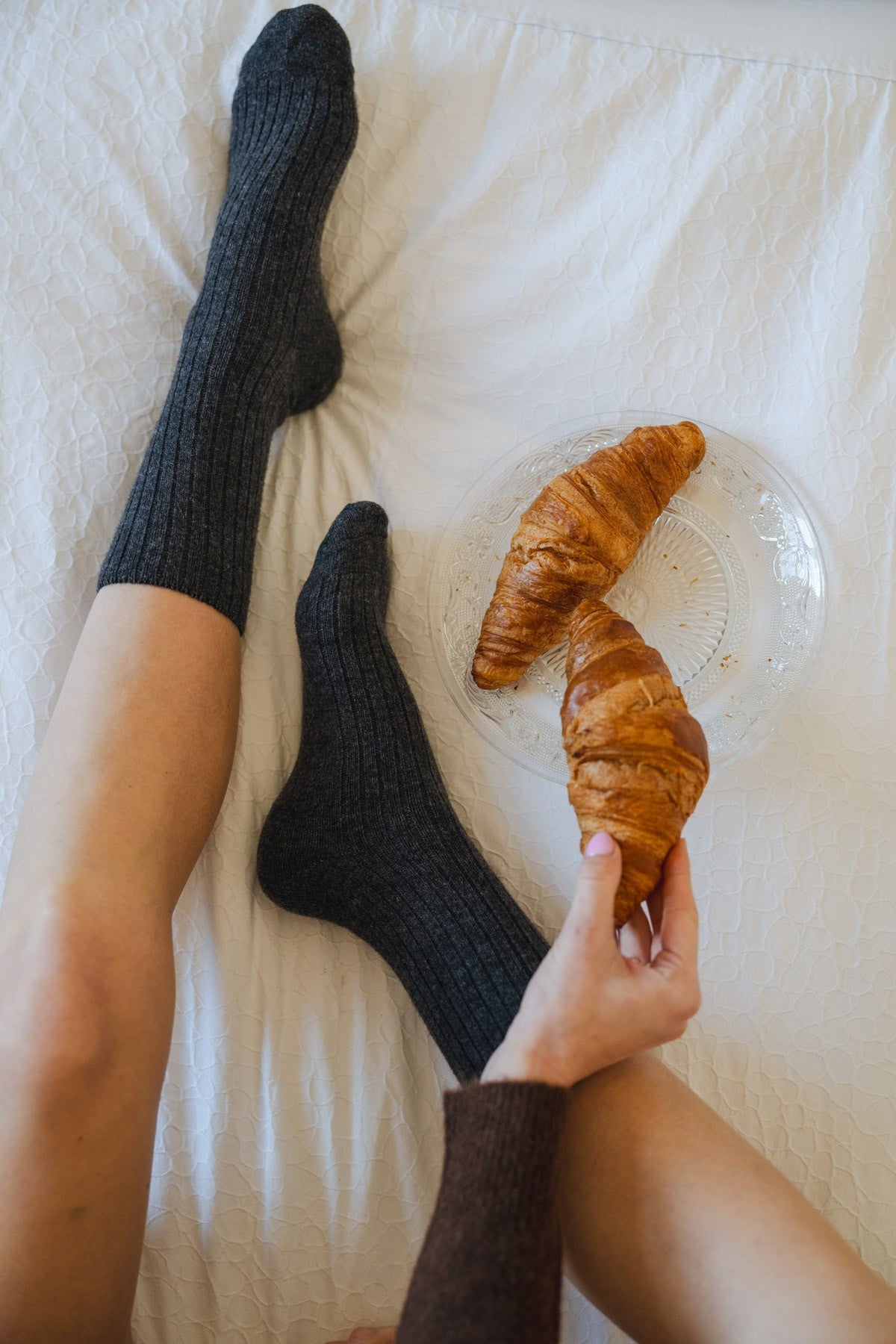 Ribbed graphite socks showing the knit texture and snug fit along the foot and ankle