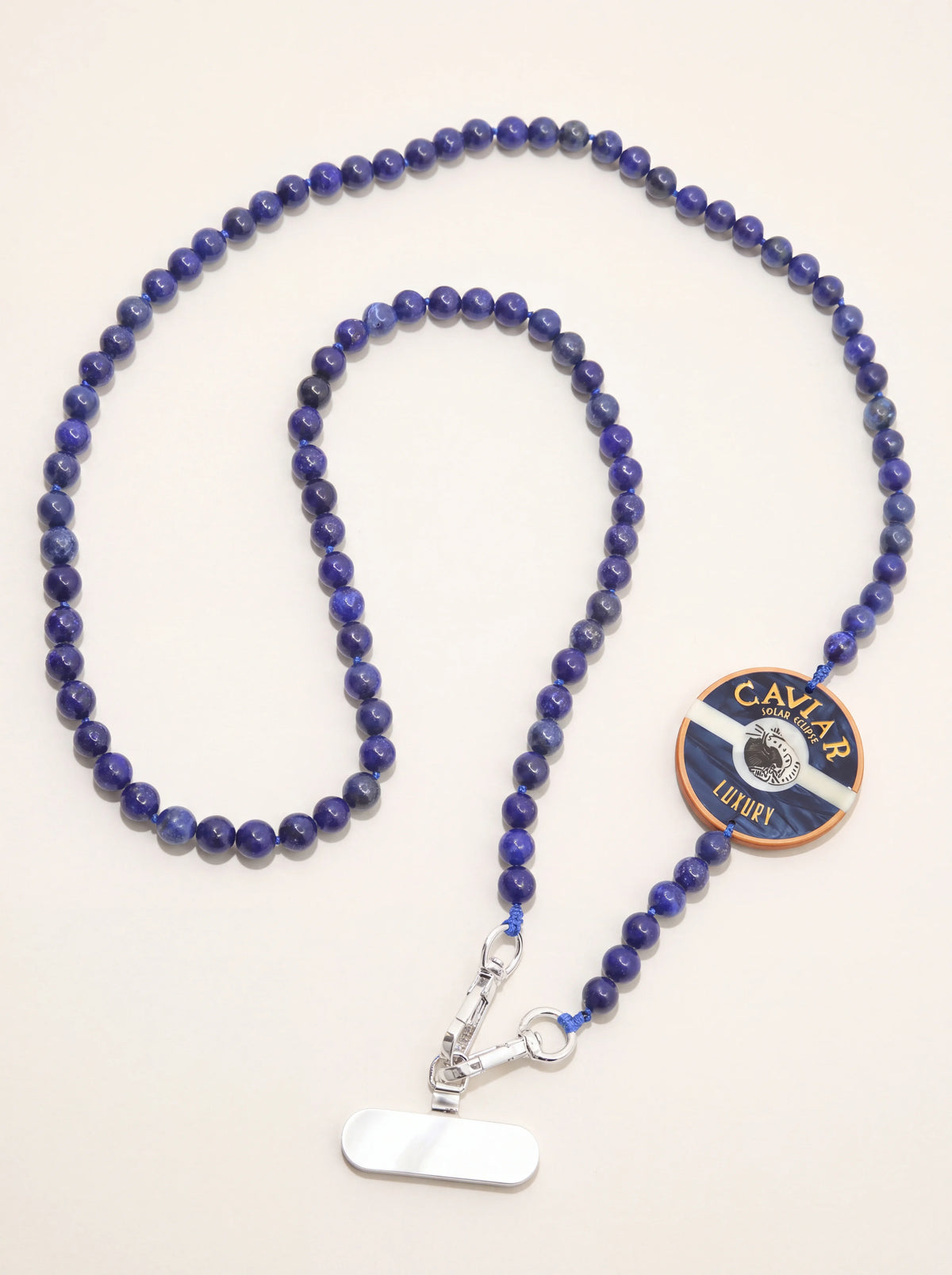 Blue gemstone beaded phone chain with a round Caviar charm, clasps and stainless-steel insert