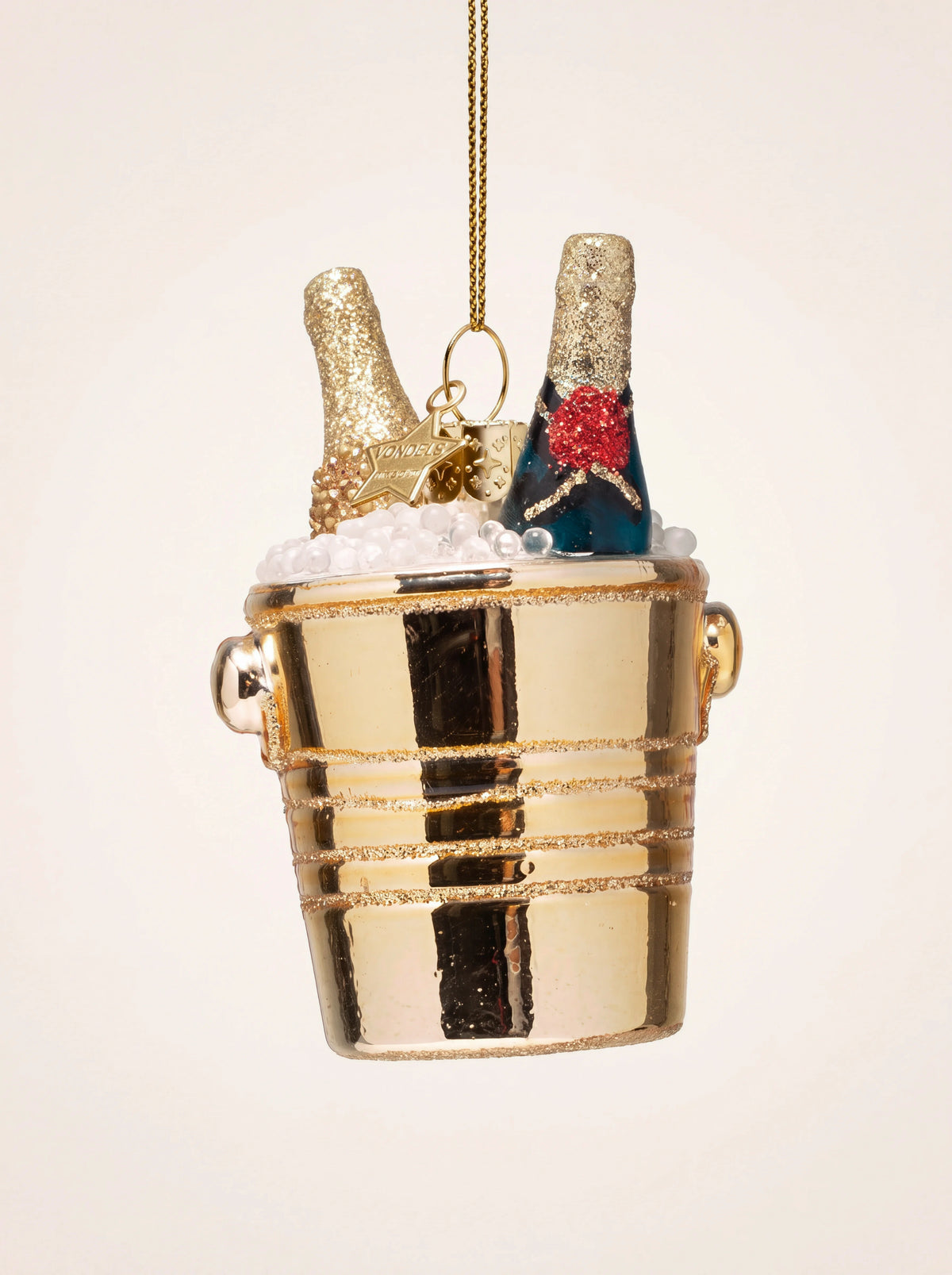 Glass champagne cooler ornament in shiny gold with two champagne bottles resting in faux ice