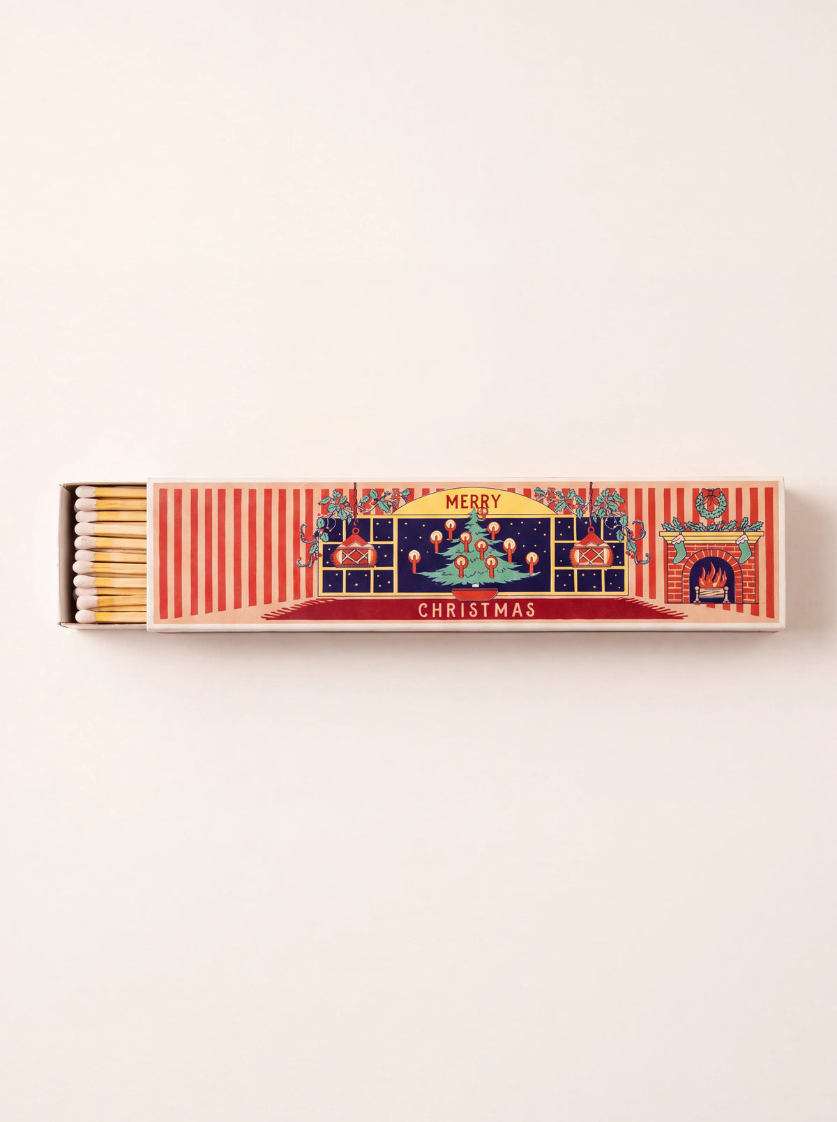 Long matchbox partly open, showing white match tips and festive cover illustration with text MERRY CHRISTMAS