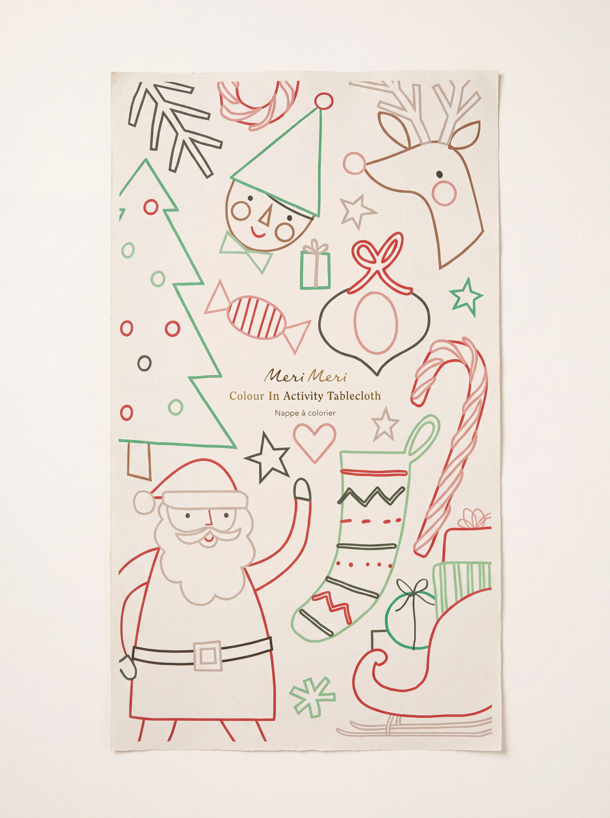 Christmas colour-in paper tablecloth with festive outlines of Santa, an elf, a reindeer and a Christmas tree