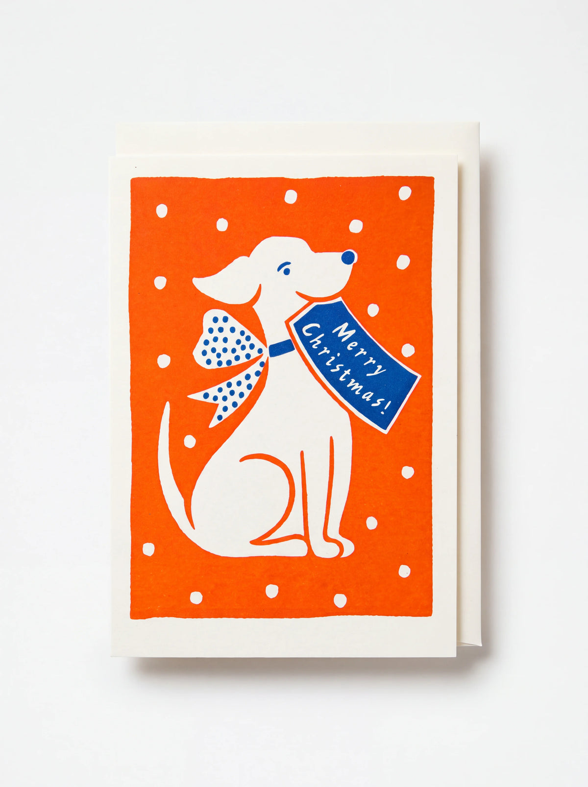 Christmas card illustrated with a white dog on an orange background holding a tag reading Merry Christmas!