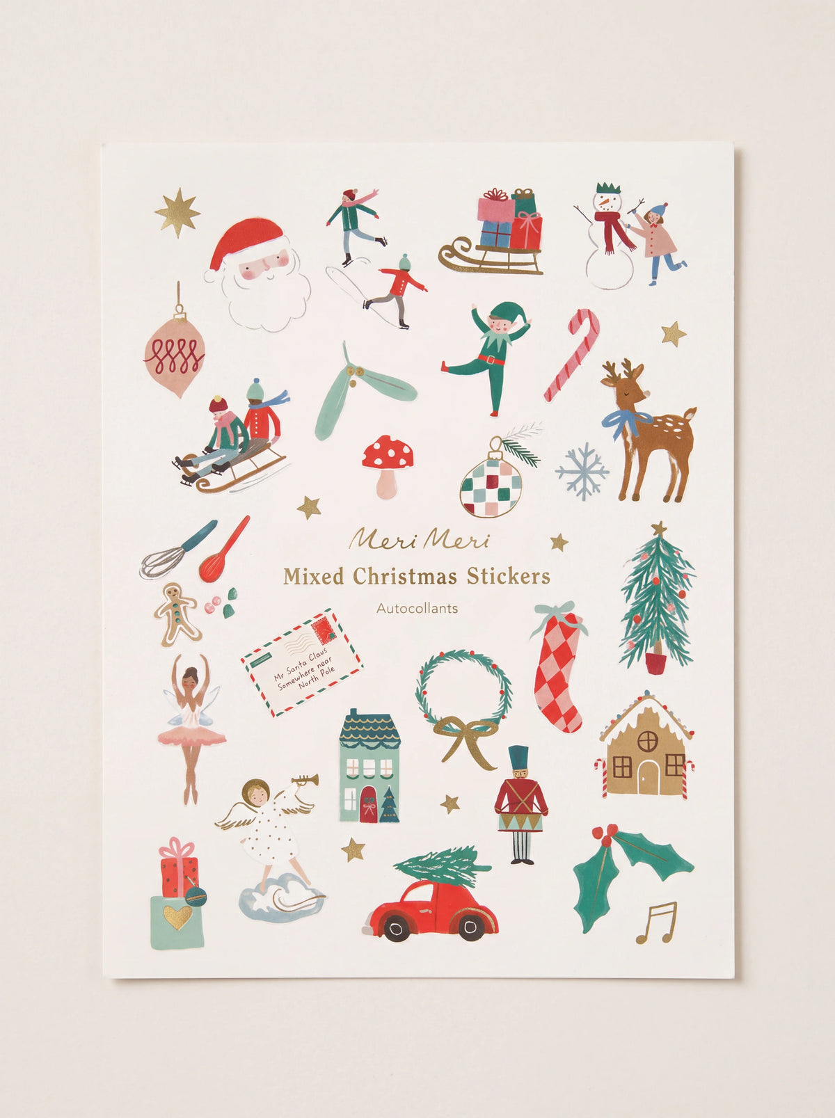 Paper Christmas sticker sheet featuring festive holiday motifs and gold foil details