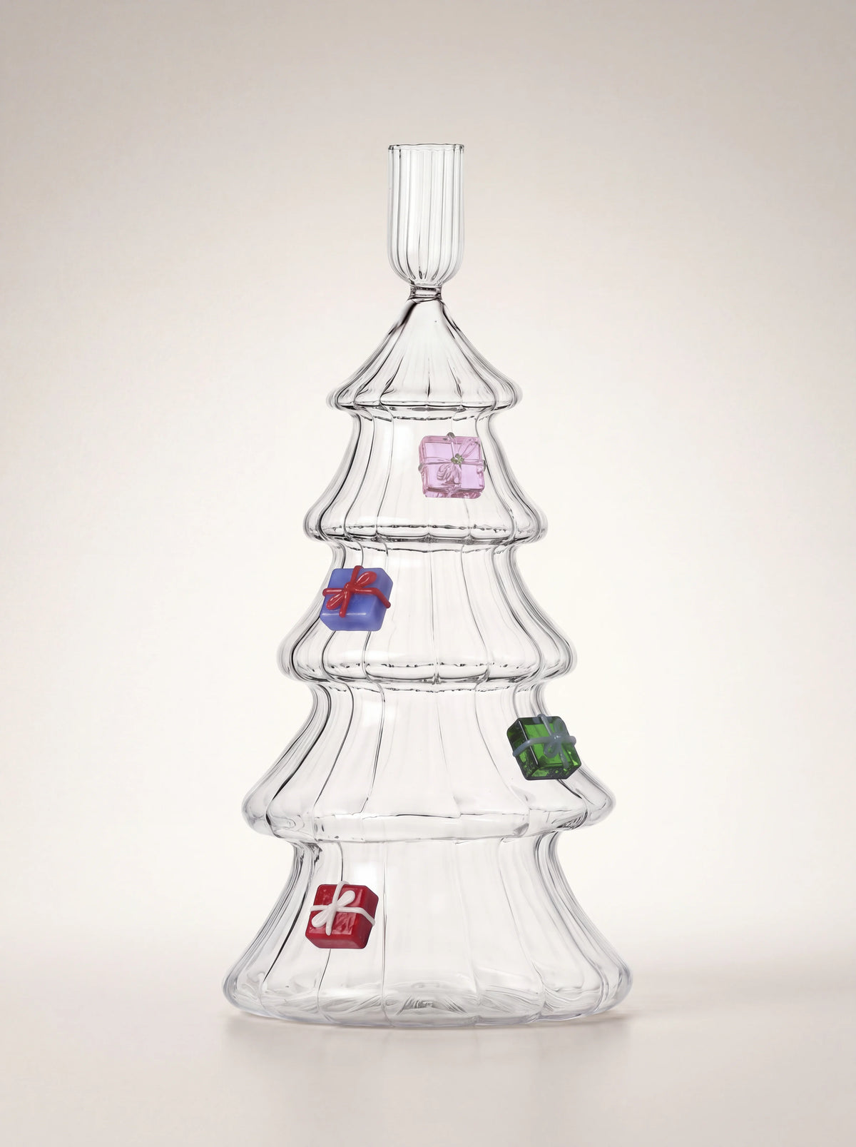 Clear glass Christmas tree candle holder with ribbed tiers and four colourful miniature gift boxes