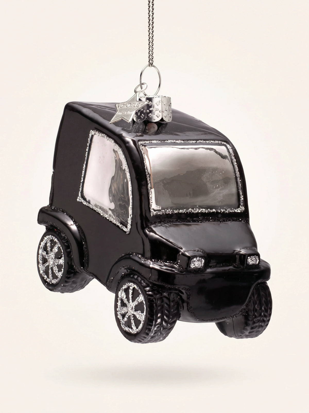 Glossy black glass city car ornament with silver glitter accents on the windows, headlights and wheel rims