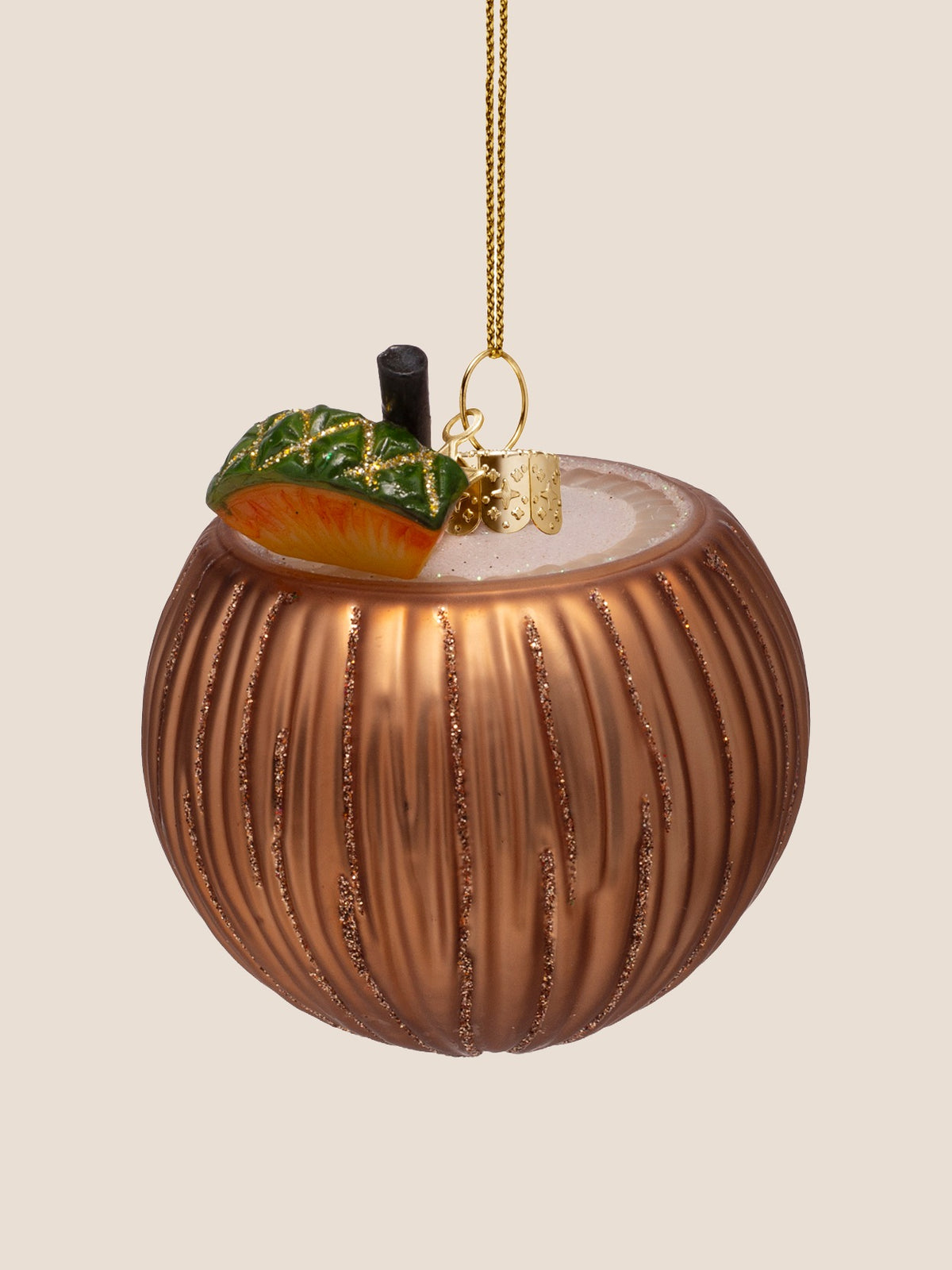 Coconut cocktail ornament turned to show the hand-painted pineapple wedge garnish and straw