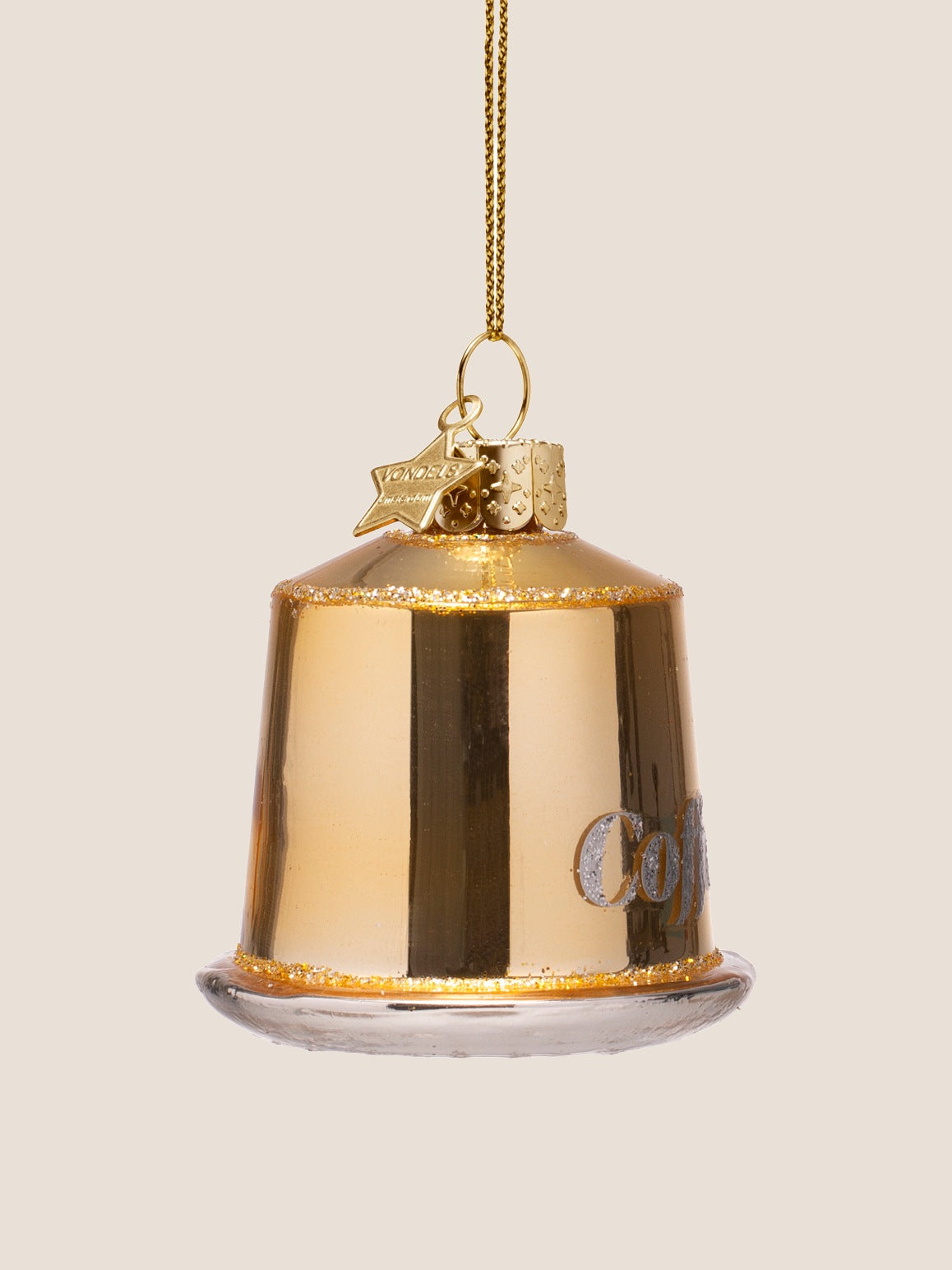 Side view of the gold glass capsule ornament showing the reflective surface and curved silver base
