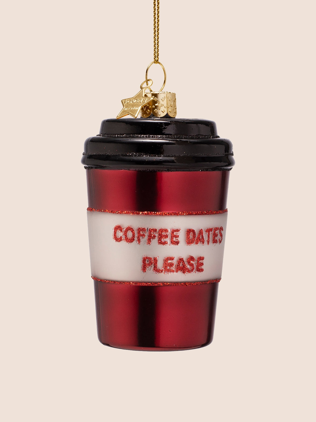 Front view of the glass ornament showing the embossed gold hanging cap, star charm and red glitter trim