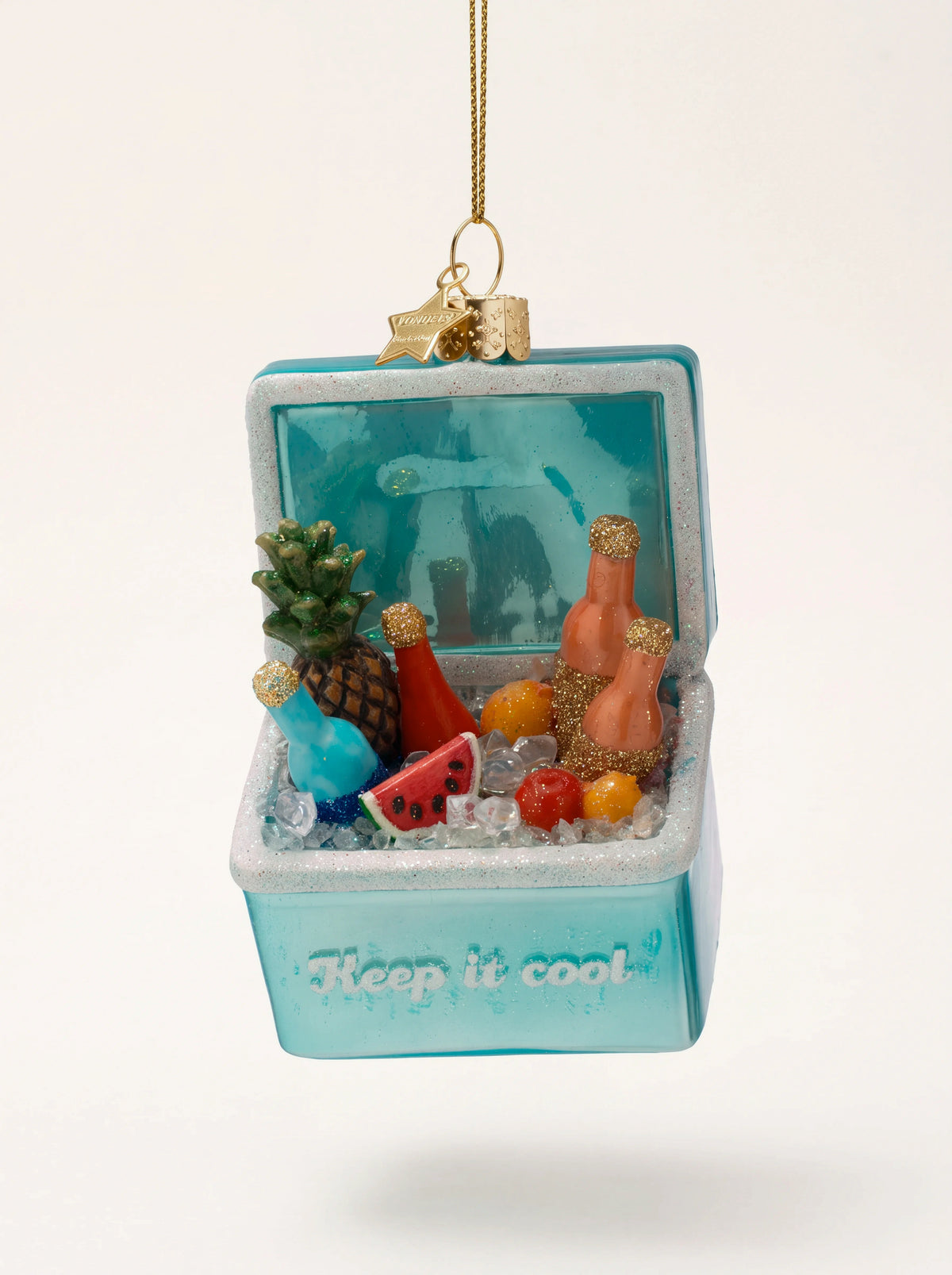 Turquoise glass cool box ornament filled with fruit and bottles in ice, reading "Keep it cool