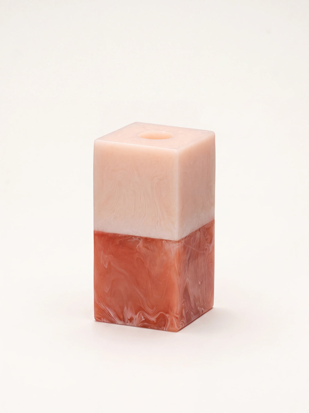 Rectangular resin candle holder with a two-tone marbled finish in blush pink and terracotta
