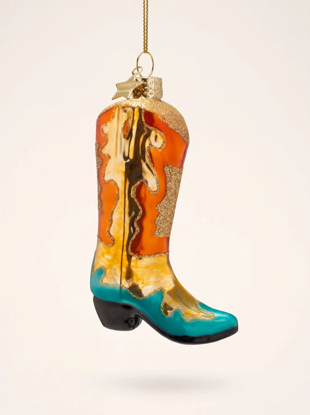 Cowboy boot glass ornament with painted orange, yellow and turquoise panels and gold glitter trim