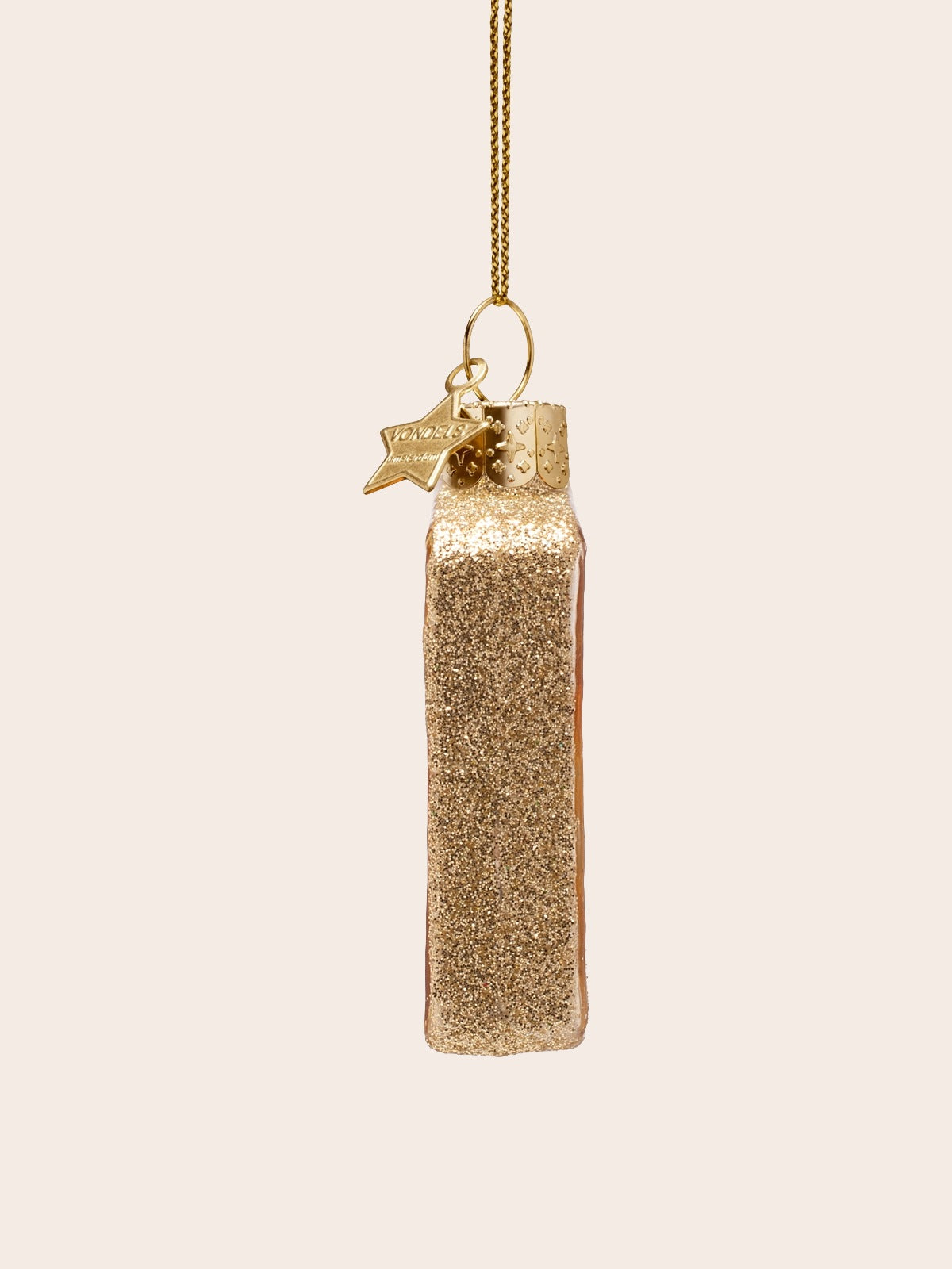 Side view of the glass ornament showing the full profile coated in gold glitter