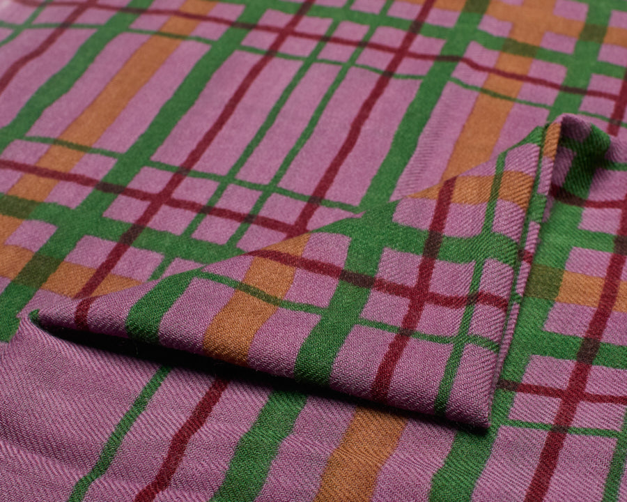 Close-up of the folded wool scarf showing the fine woven texture and printed check details