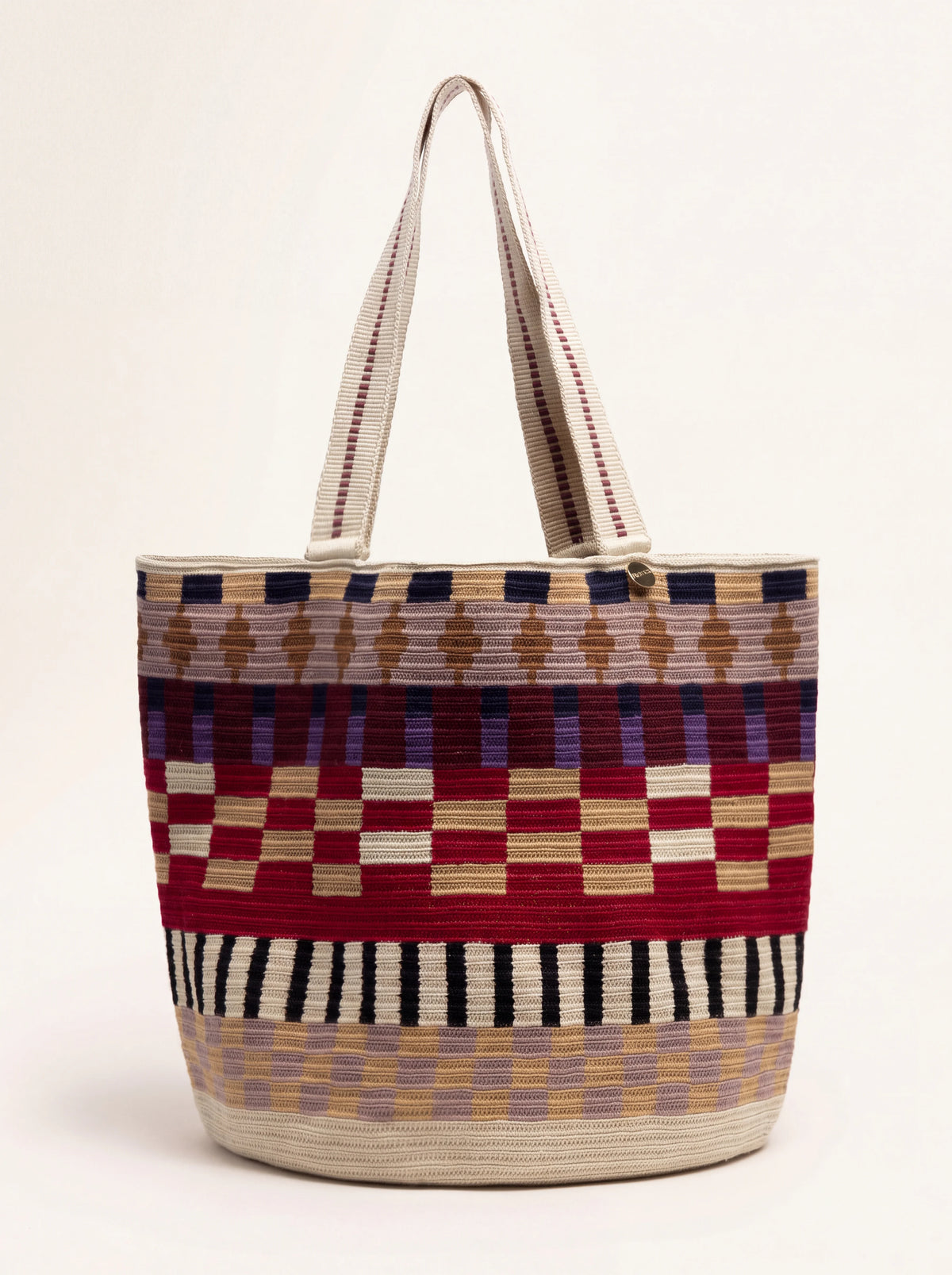 Crochet tote bag with multicoloured geometric pattern in burgundy, toast and cream, with two shoulder straps
