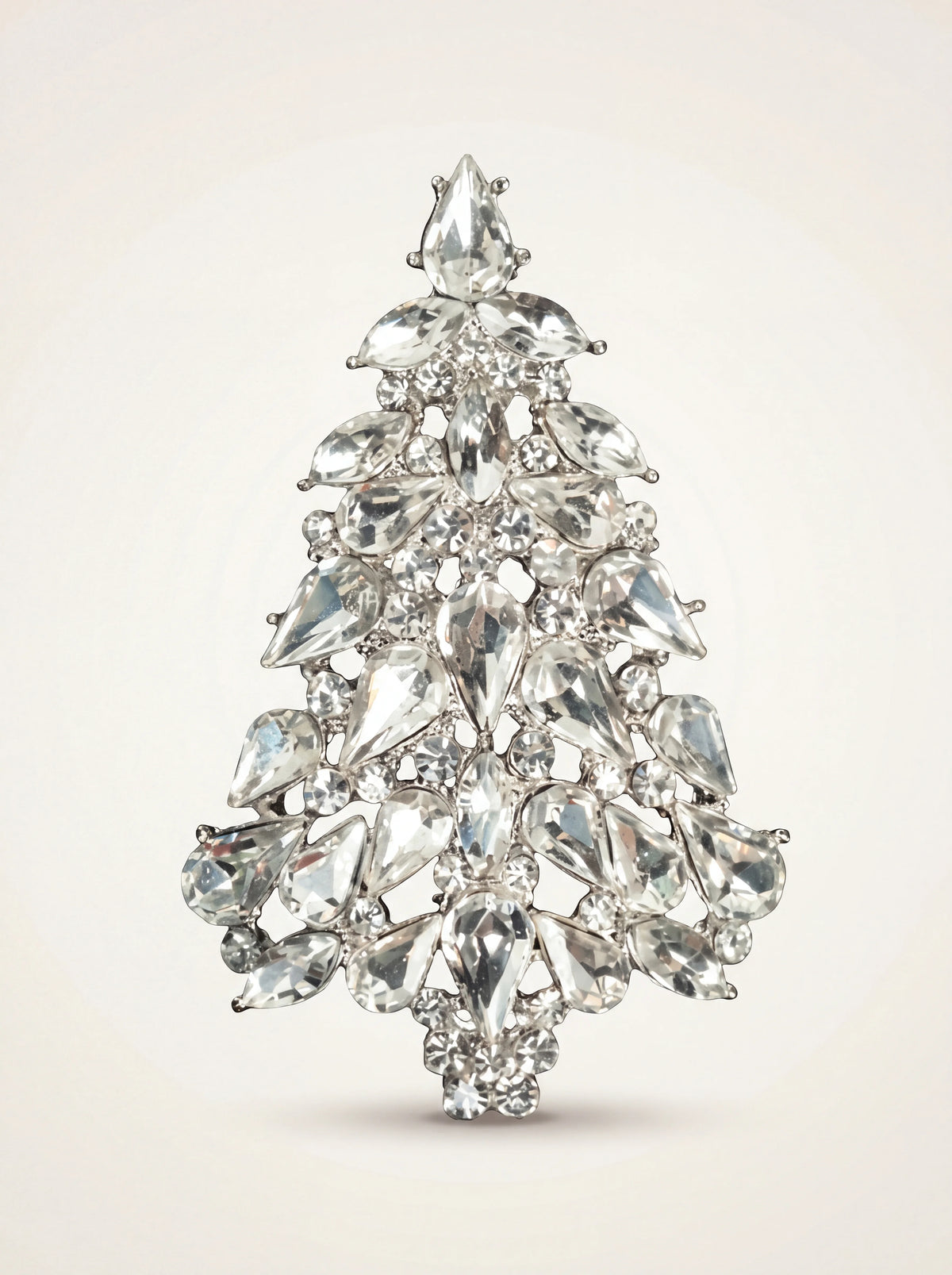 Christmas tree brooch with faceted clear crystals in a silver-coloured setting