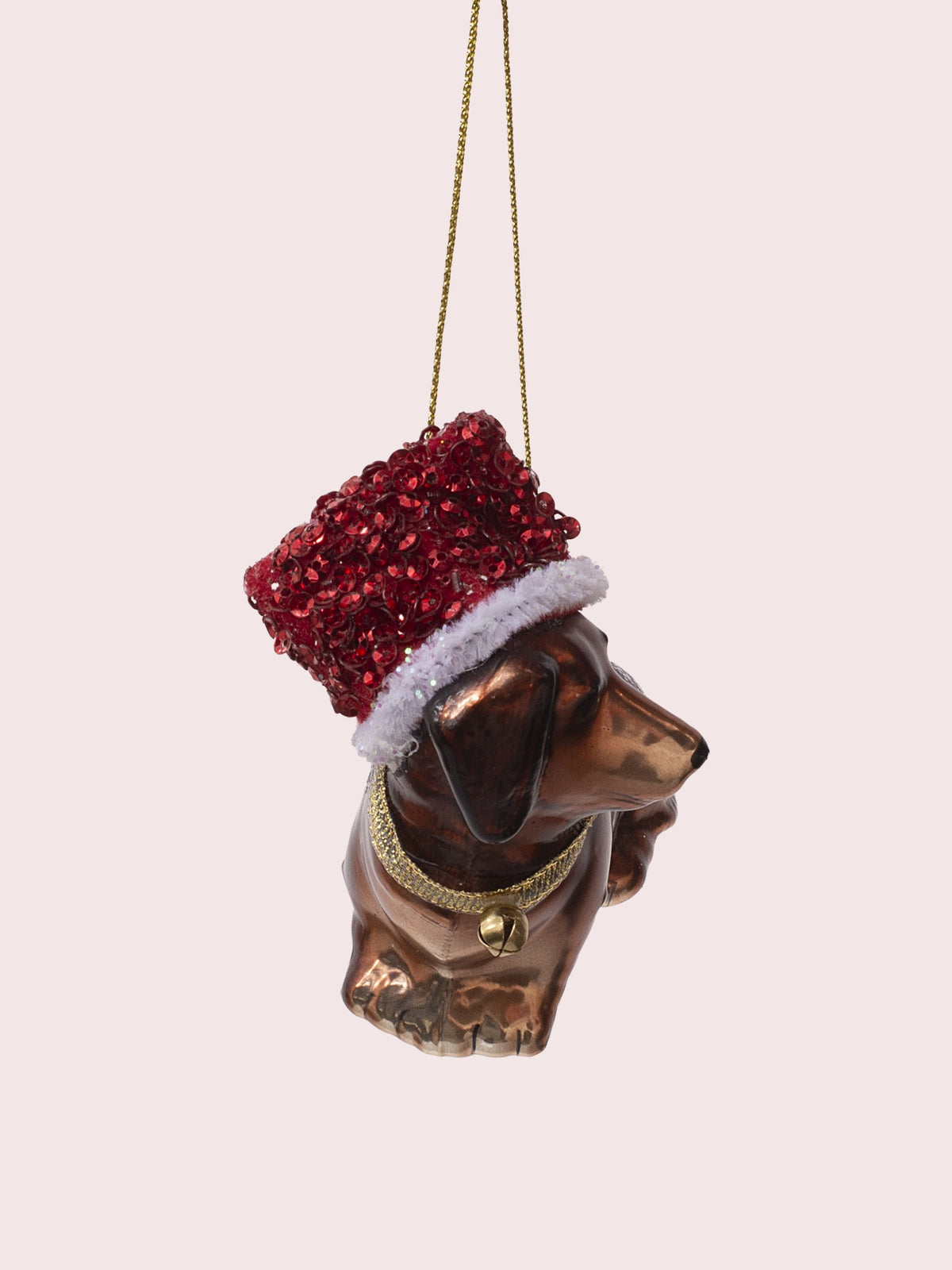 Front angle showing the painted face in profile, textured red hat and front paws