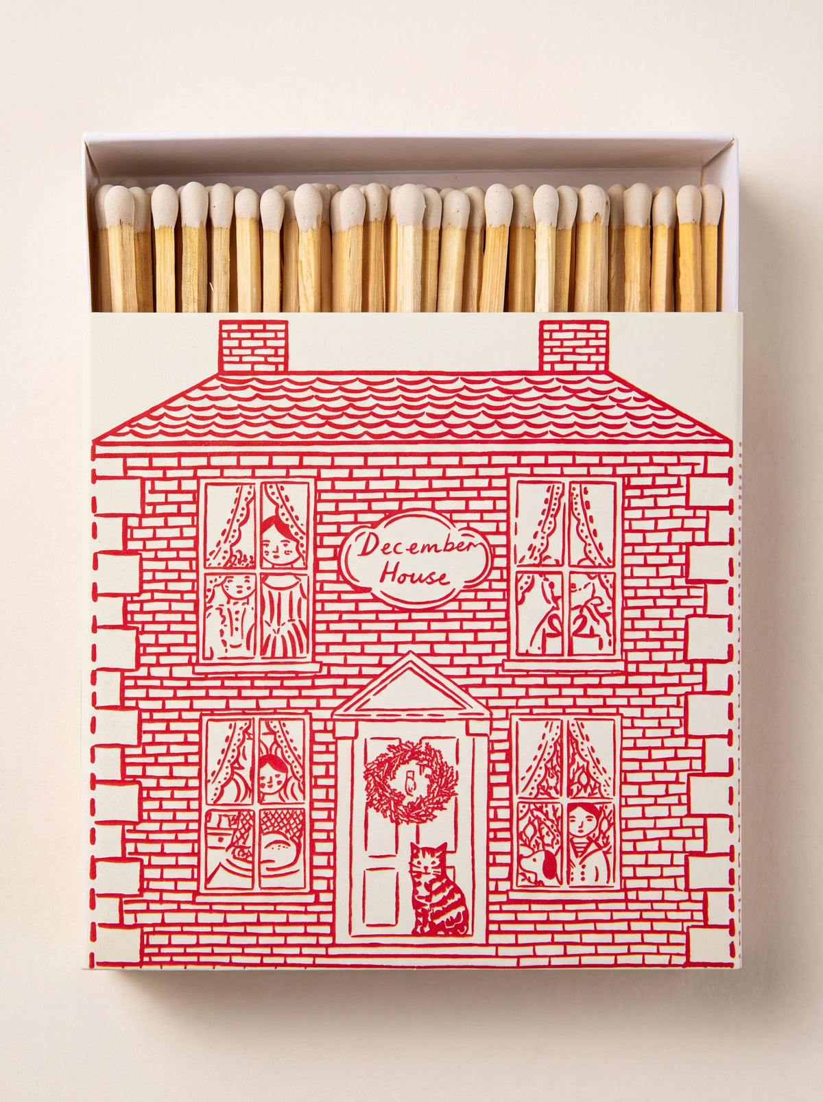 Matchbox with red line illustration of a house labelled 'December House', open to show wooden matches