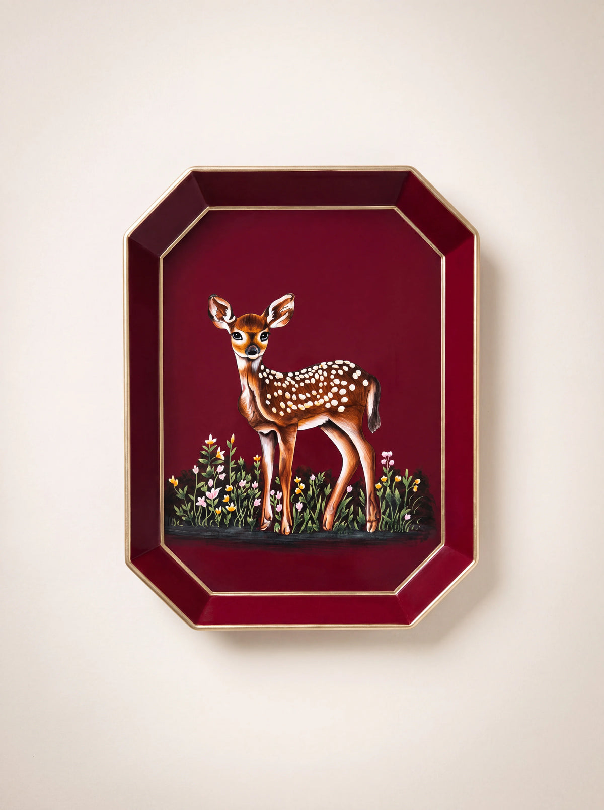 Octagonal deep red iron tray painted with a spotted deer and wildflowers, with a gold-coloured rim